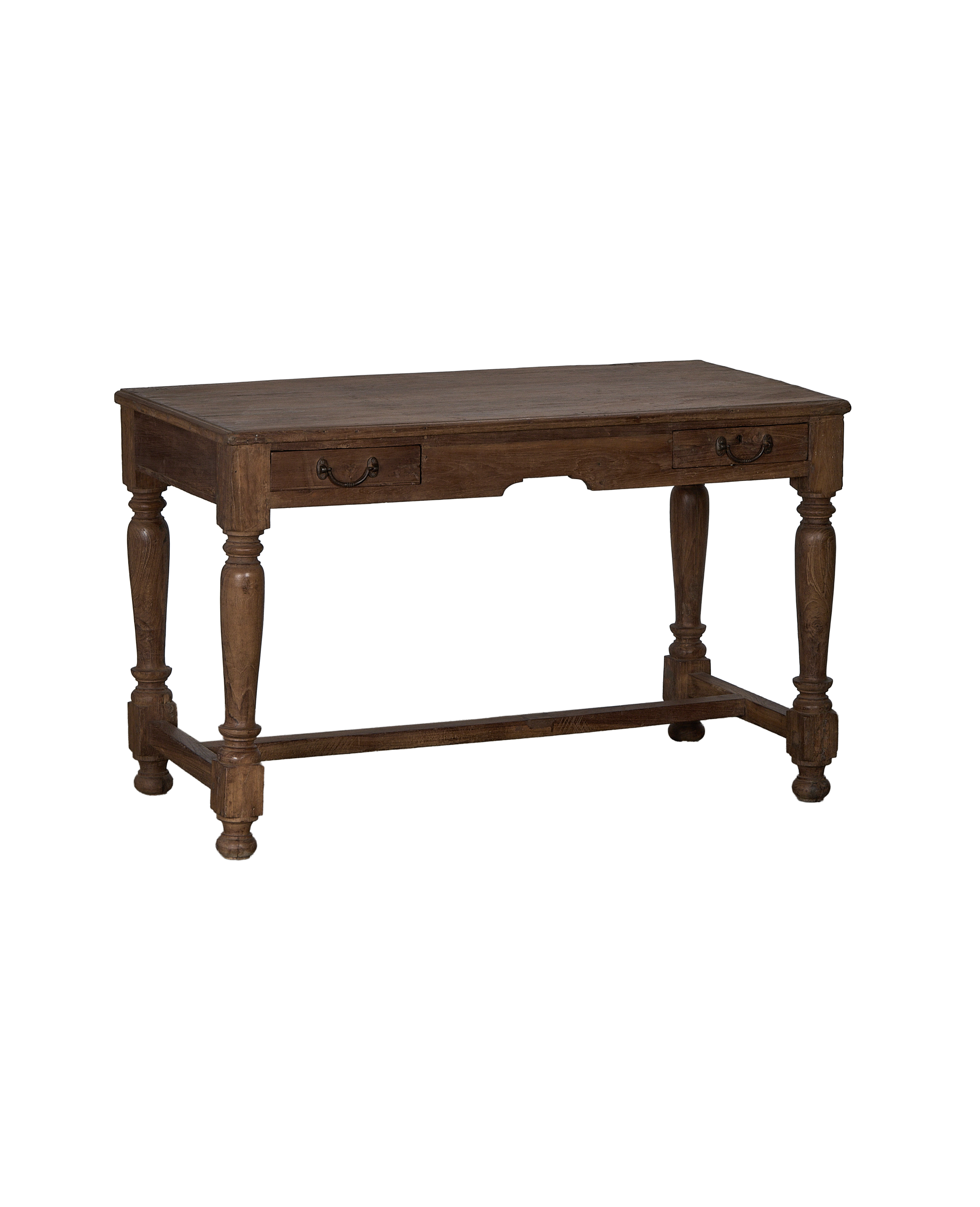 Vintage Indian oak wood desk, angled view, showing turned legs and two drawers.