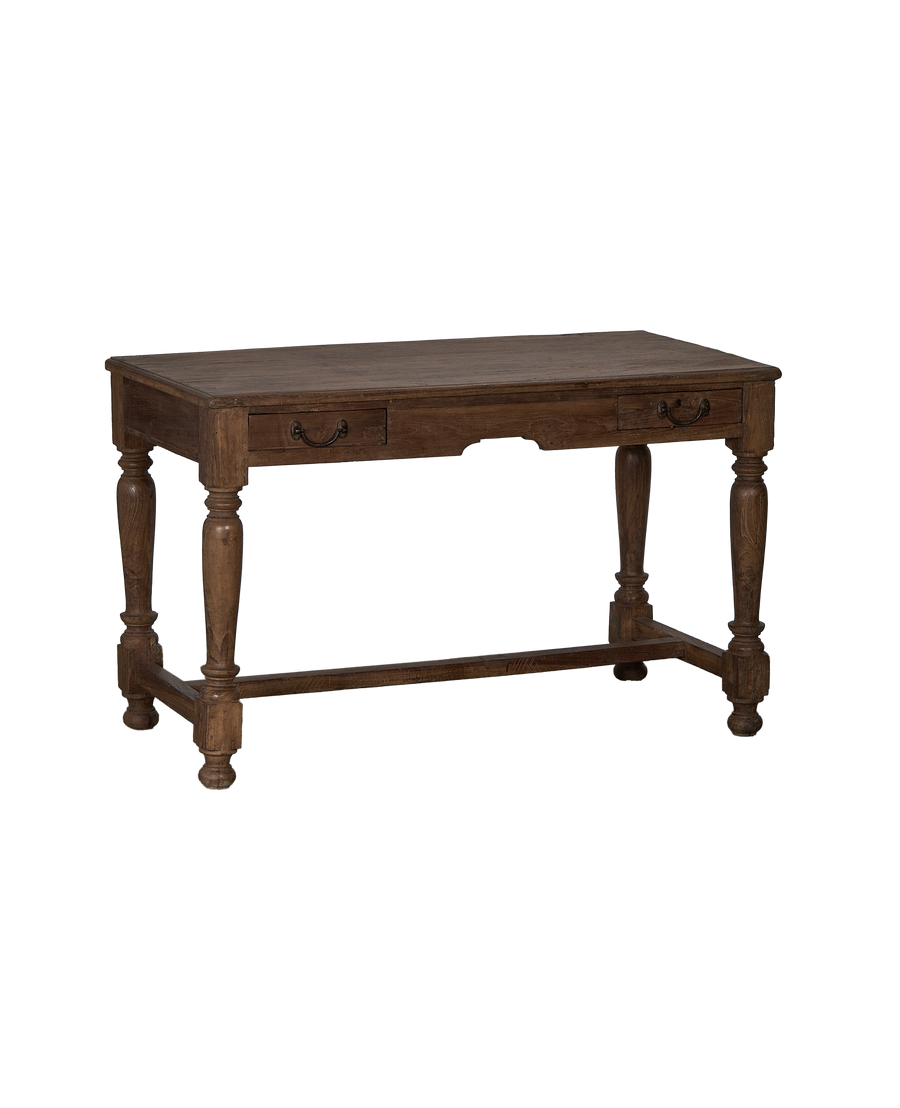 Vintage Indian oak wood desk, angled view, showing turned legs and two drawers.