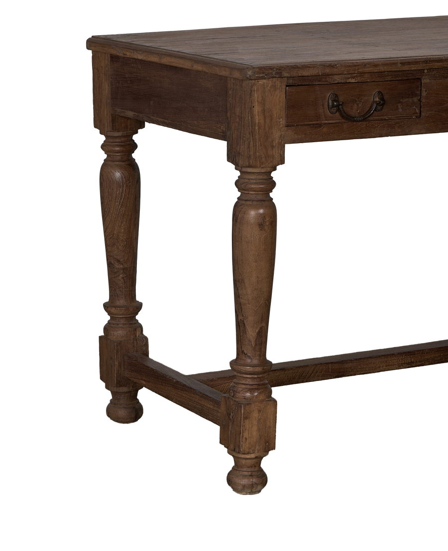 Vintage oak desk with antique pull handle and distressed natural wood grain.