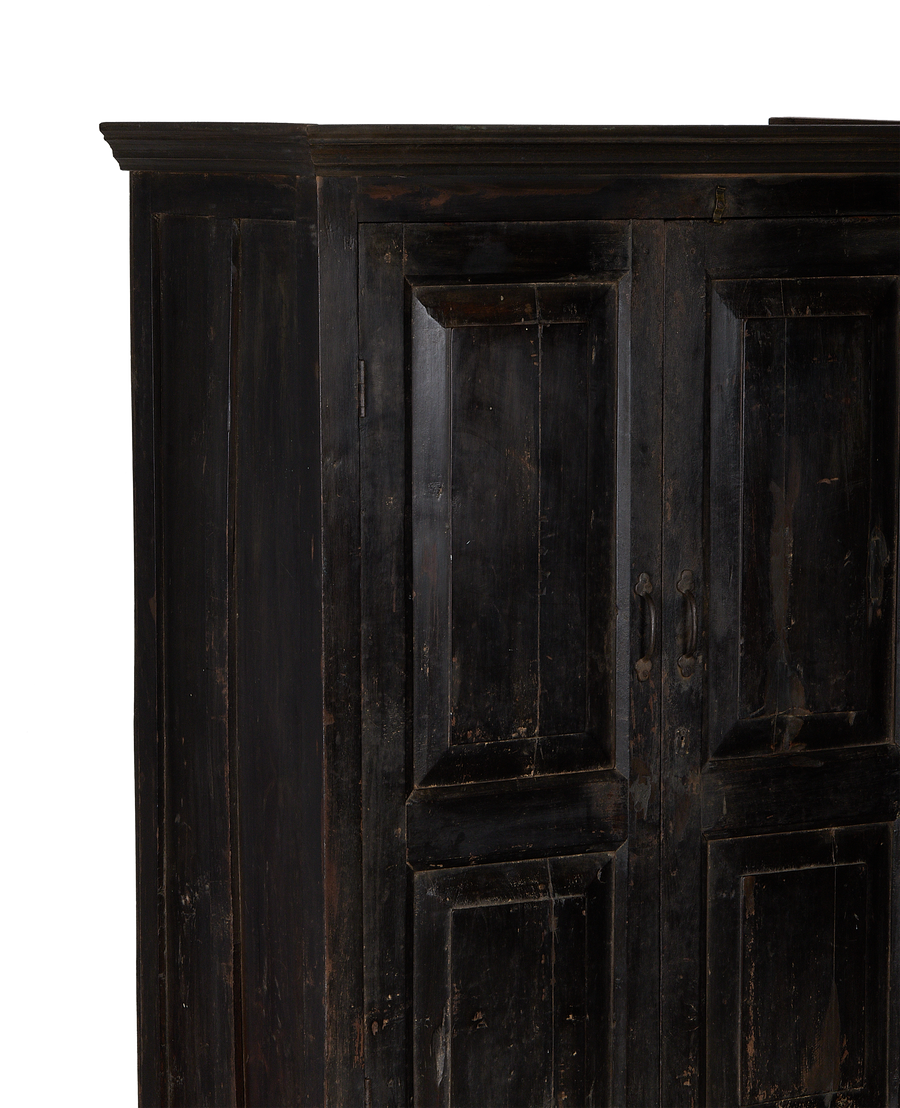 Vintage Indian oak wood cabinet, showing one door and top trim detail.