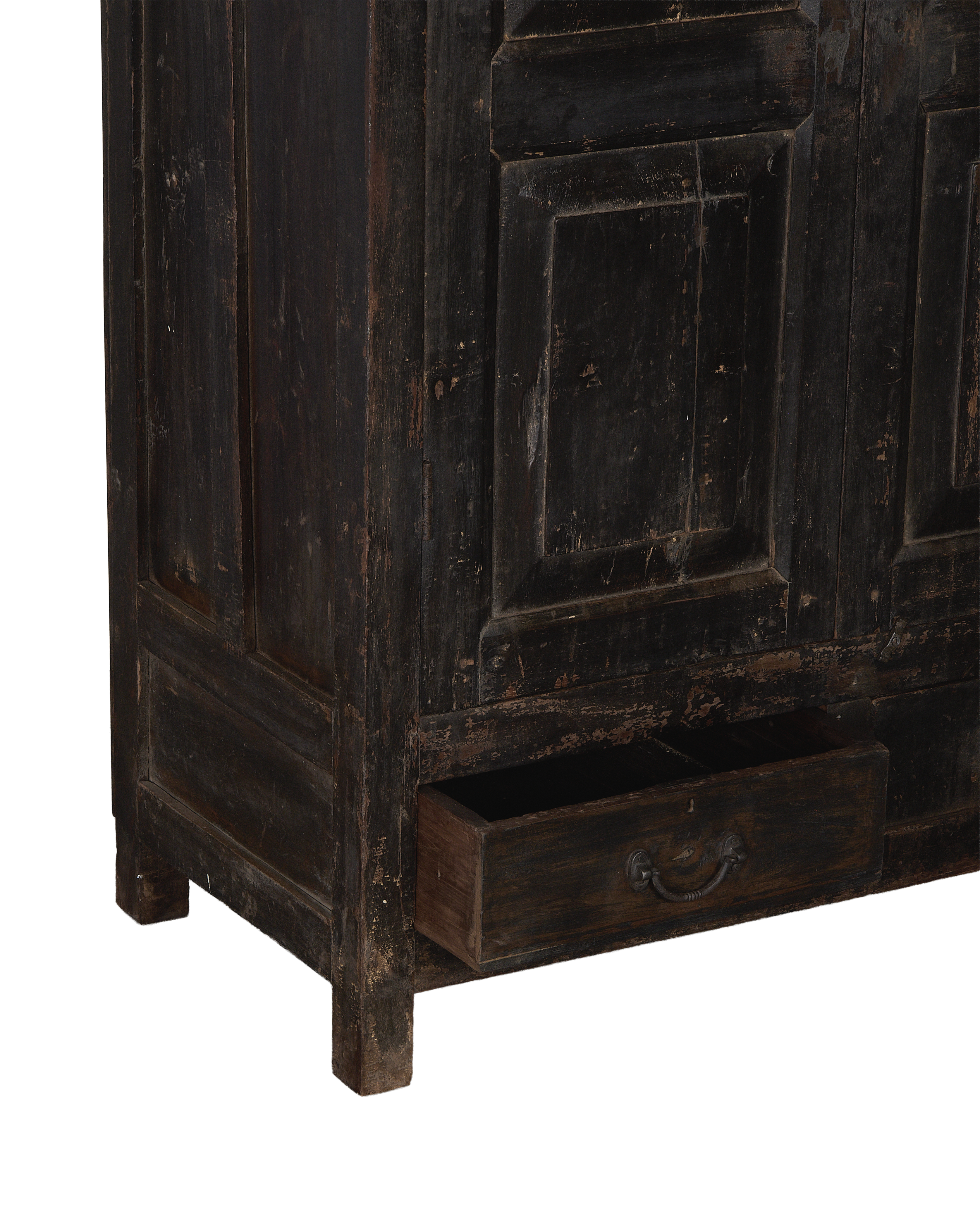 Vintage Indian oak cabinet detail, distressed dark wood, open drawer with metal pull.