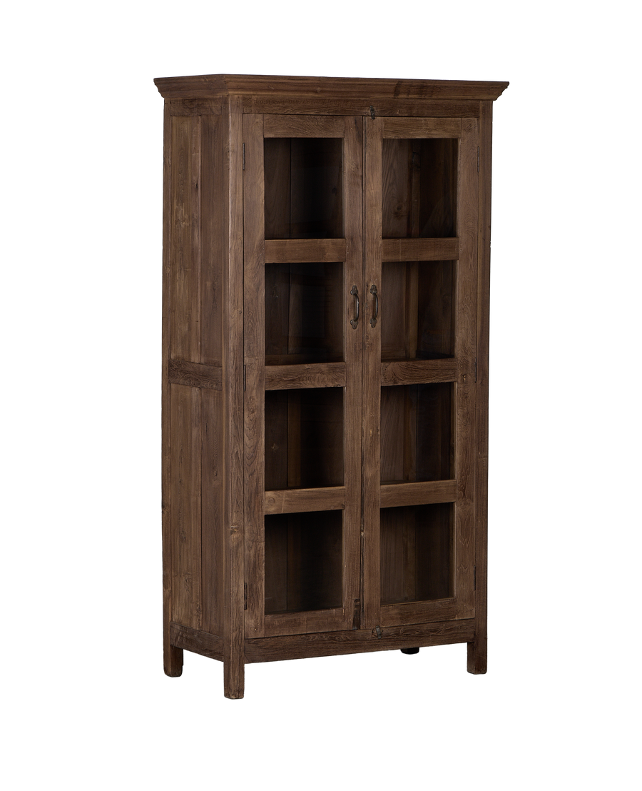 Vintage Indian oak cabinet from an angled front view, showcasing natural wood grain, glass doors, and dark handles.