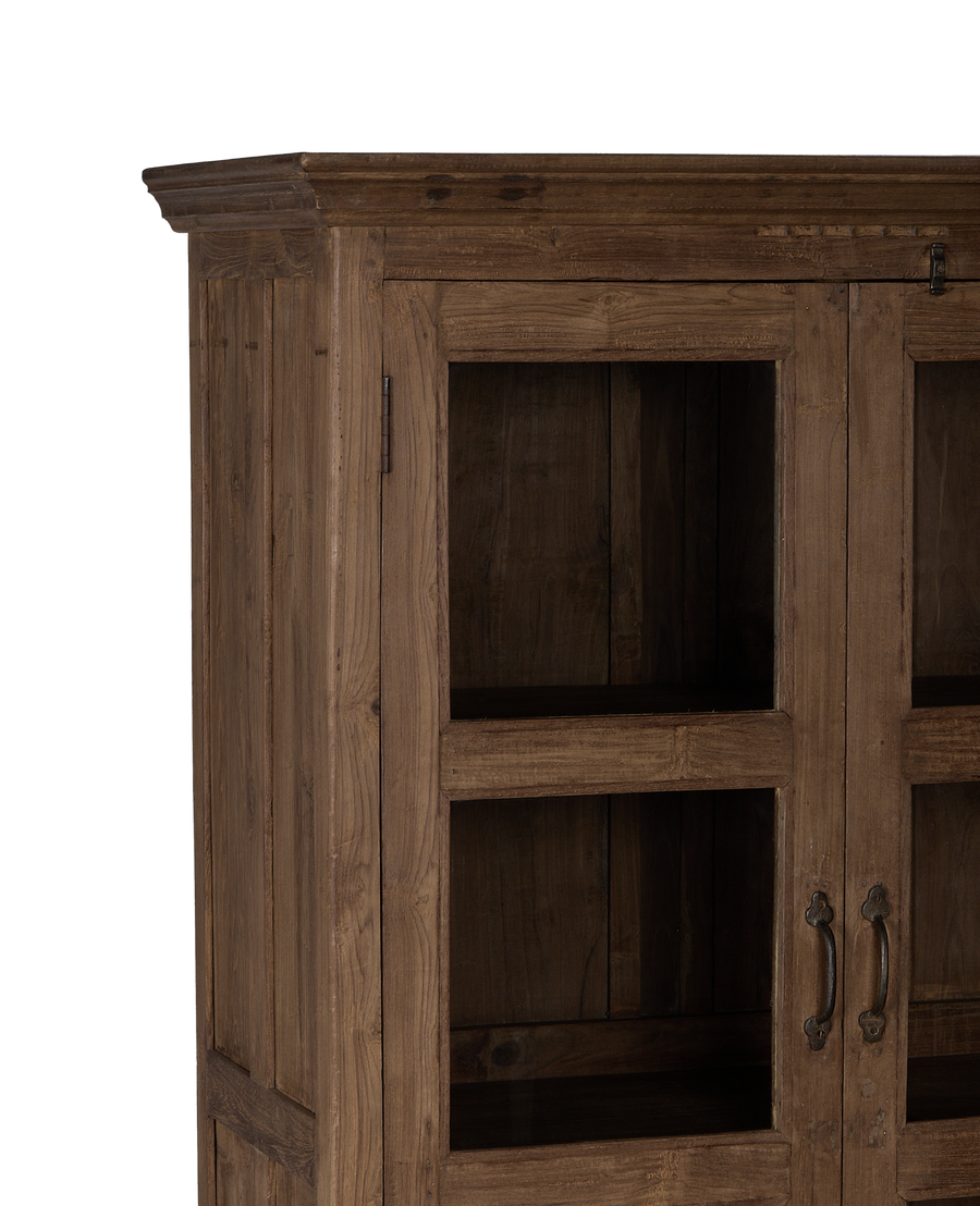 Vintage Indian oak wood cabinet, close-up of natural distressed wood grain and glass-paned doors.