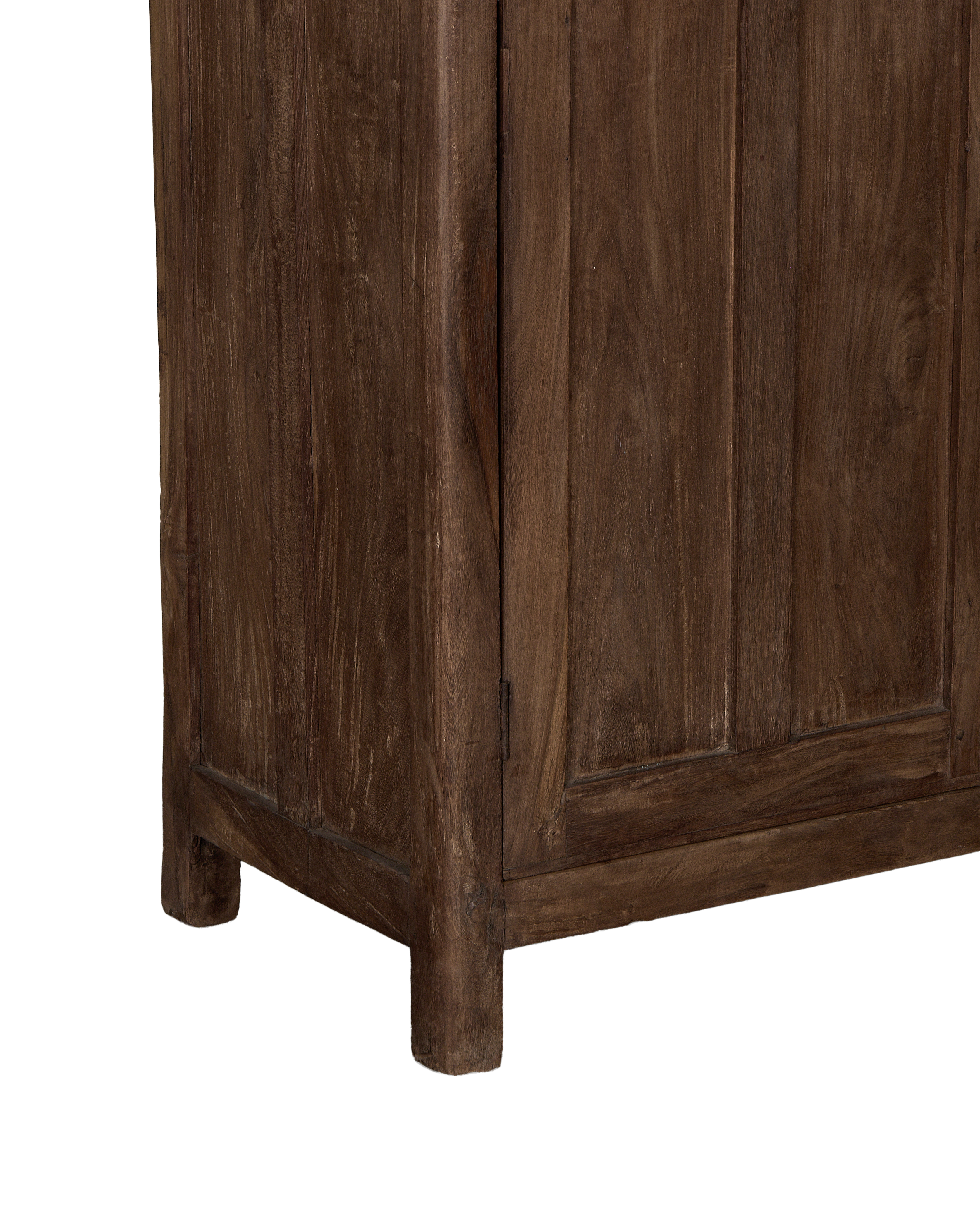 Vintage Indian oak cabinet bottom corner, showing natural wood texture and sturdy design.