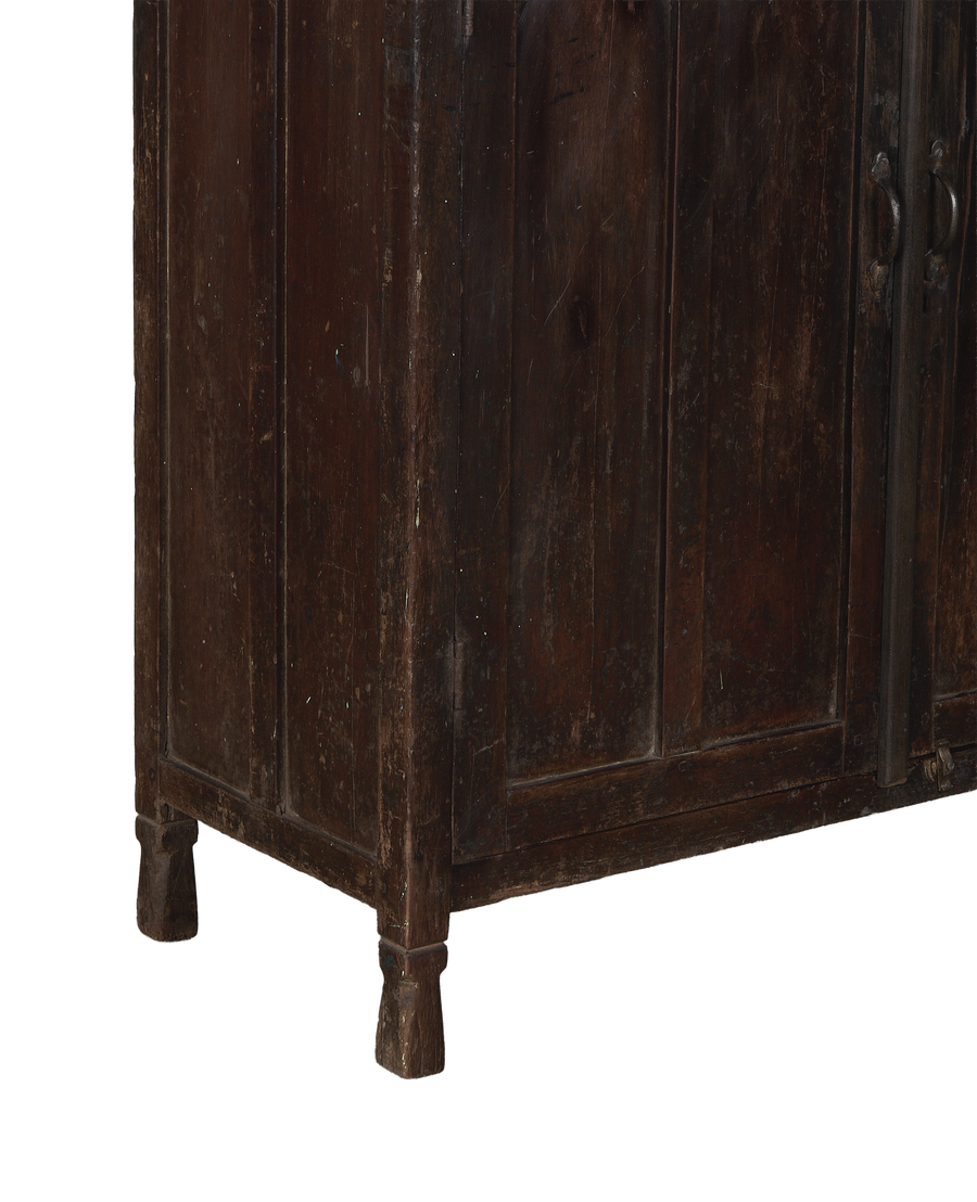 Vintage Indian oak cabinet, distressed dark wood texture, and sturdy turned leg details.
