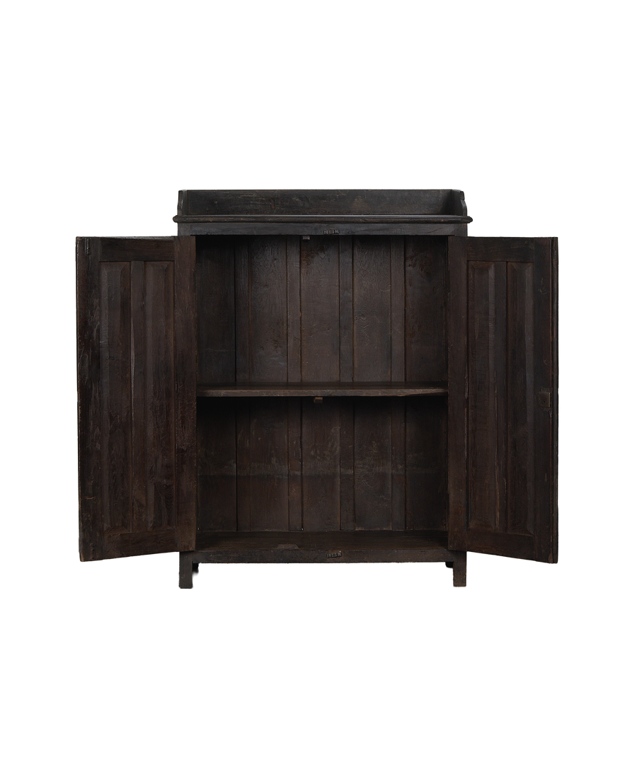 Open doors on vintage Indian stained oak cabinet, revealing interior shelves and aged wood.