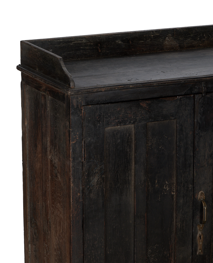 Vintage Indian oak cabinet details, showing distressed dark wood grain and top molding.