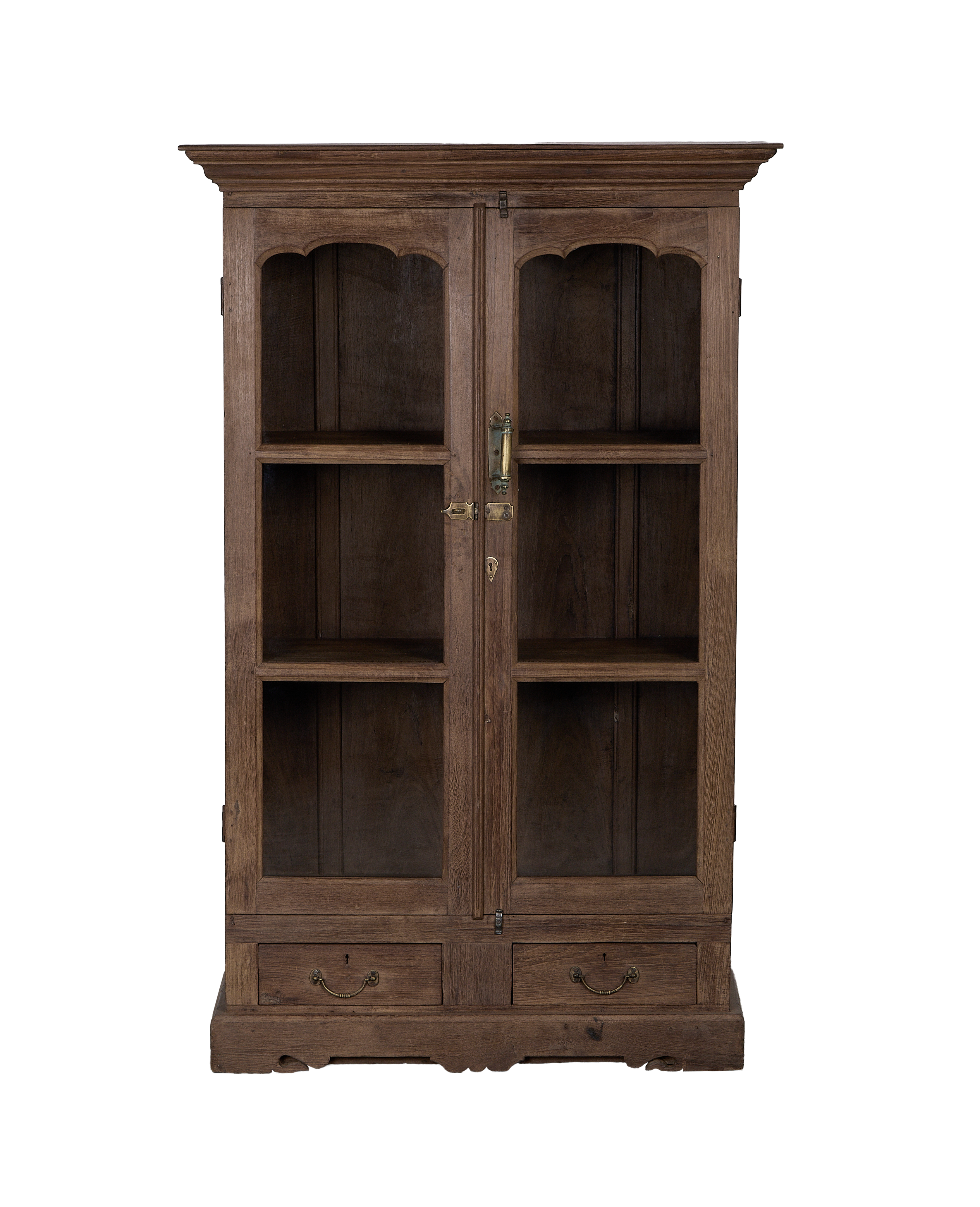 Vintage Indian oak wooden cabinet with glass doors, brass hardware, and two drawers.