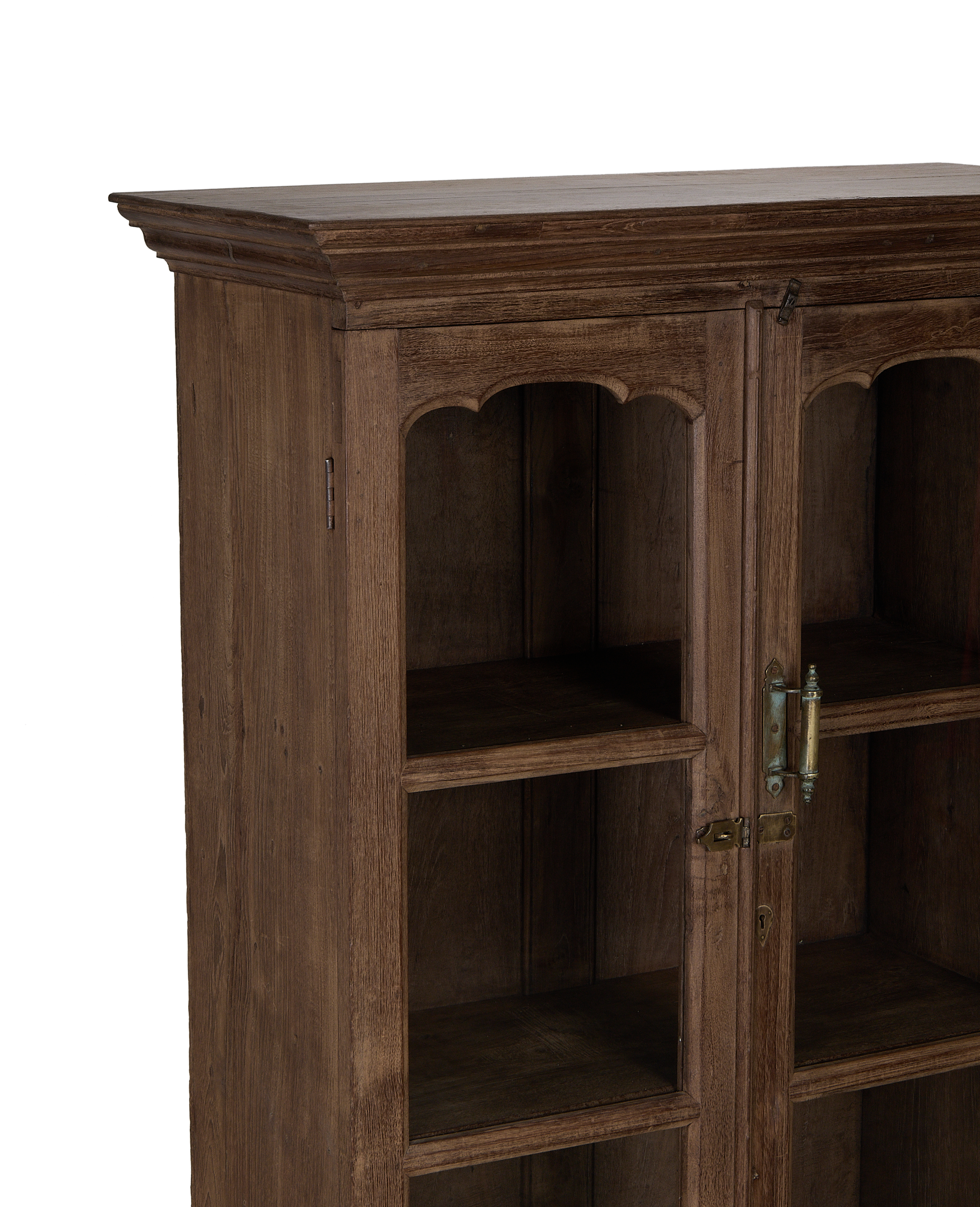 Vintage Indian oak cabinet: detailed close-up of decorative arched shelves and ornate latch.