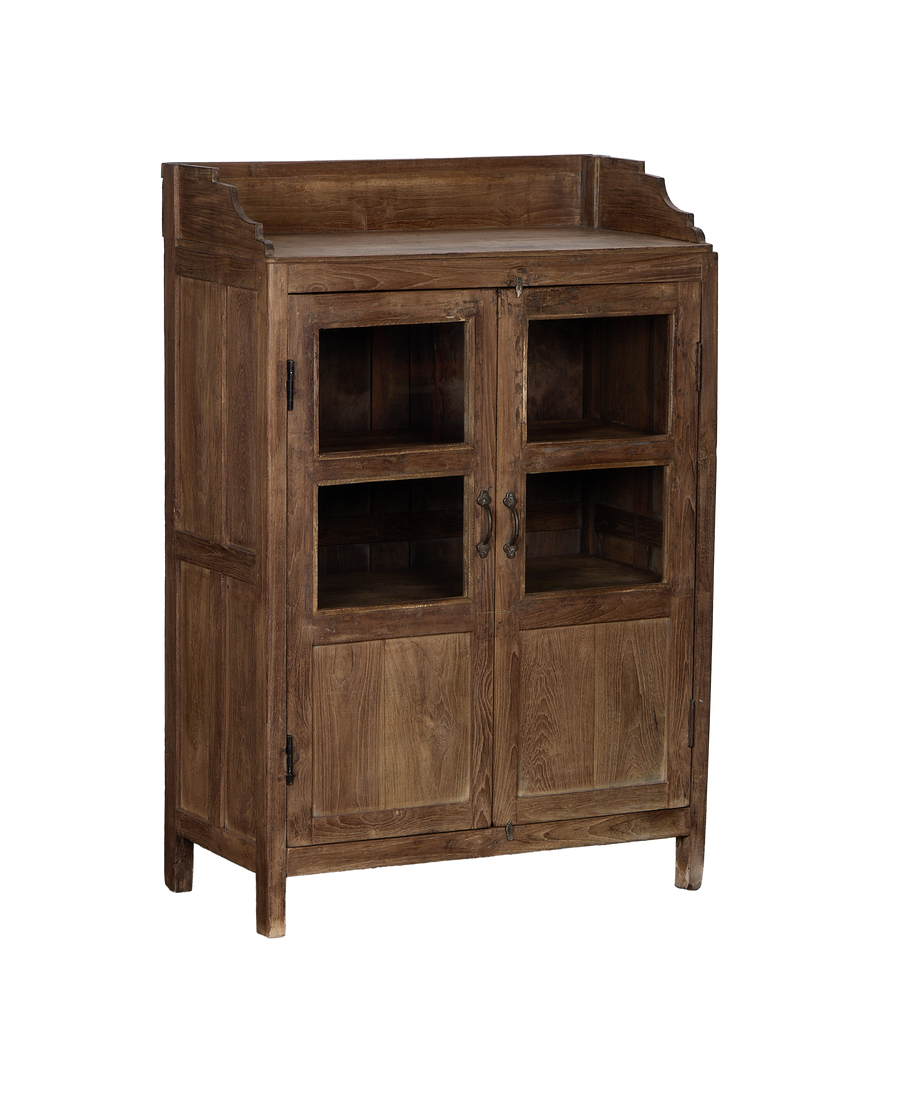Angled view of vintage Indian oak wood cabinet, showing glass doors, brass pulls.