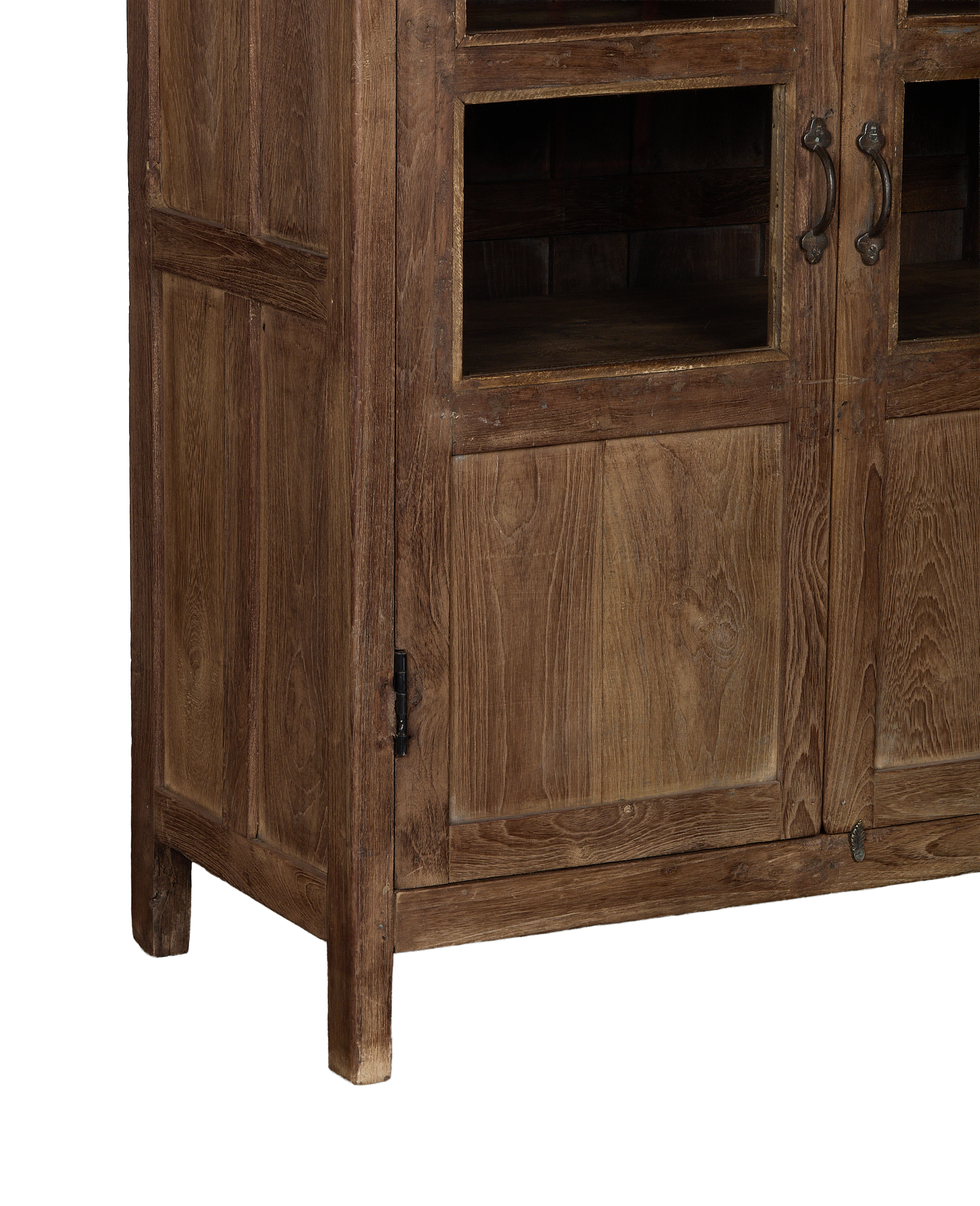 Vintage oak wood cabinet angle highlighting natural grain, glass doors, and iron hardware.