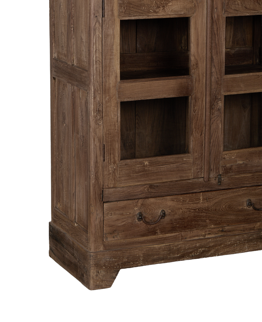 Vintage oak cabinet from India, showing drawer with aged brass handle and glass door.