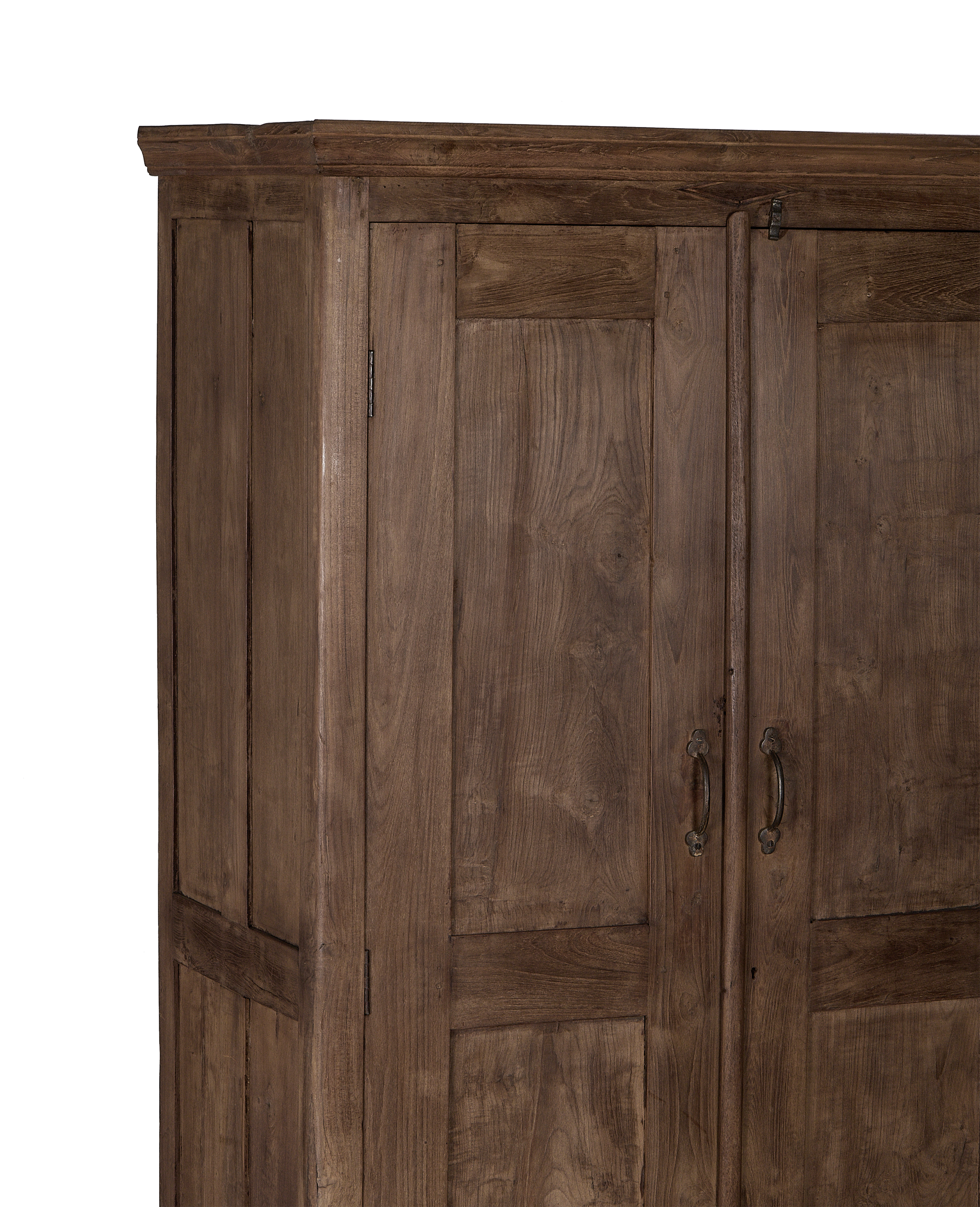 Vintage Indian oak cabinet featuring natural wood grain and ornate brass handles.