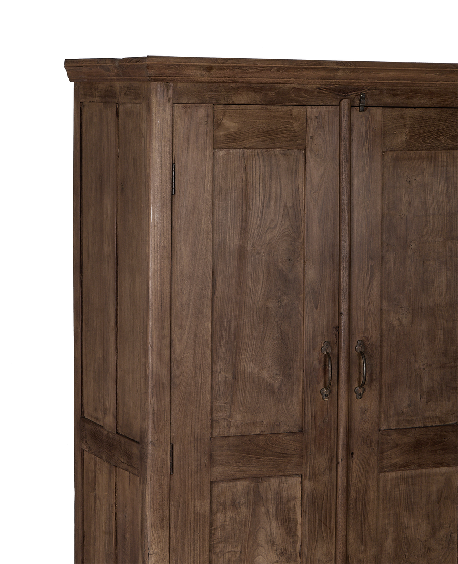 Vintage Indian oak cabinet featuring natural wood grain and ornate brass handles.