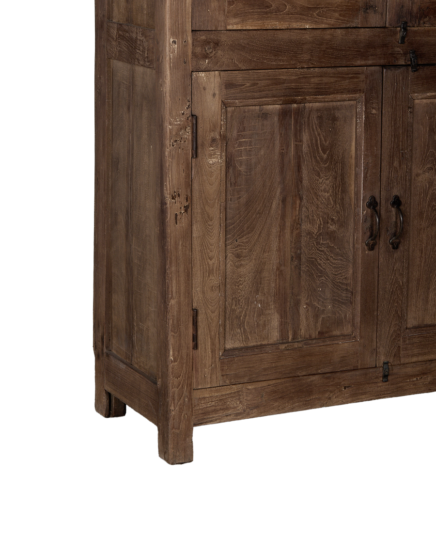 Vintage Indian oak wood cabinet, close-up of distressed rustic wood paneling and antique hinges.