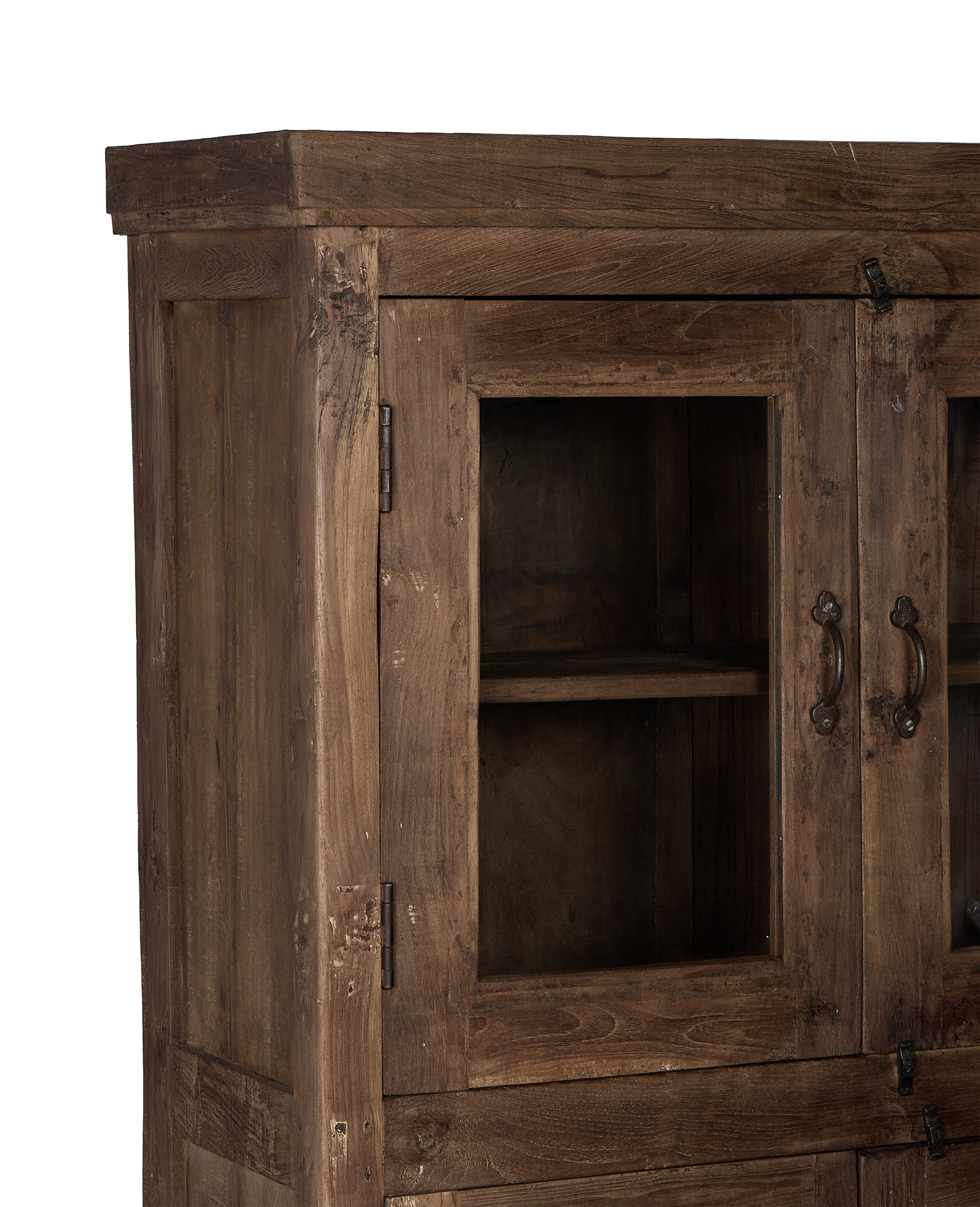 Close-up of vintage Indian oak wood cabinet's glass door, hinges, and pull handle.