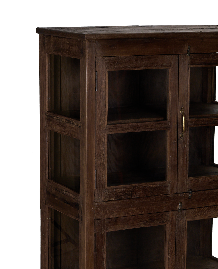 Close-up showing the rustic patina and rich grain of the vintage oak wood cabinet.