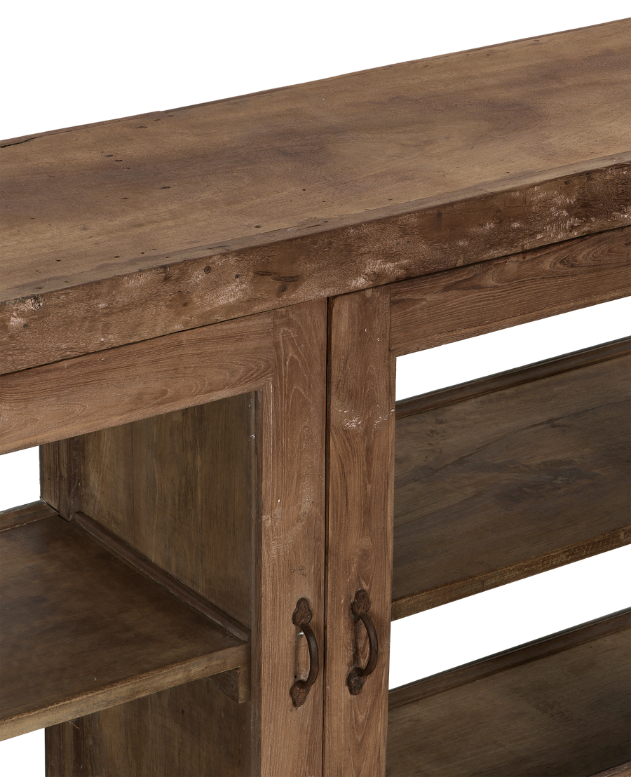 Vintage Indian oak sideboard's distressed natural wood top and metal handles.