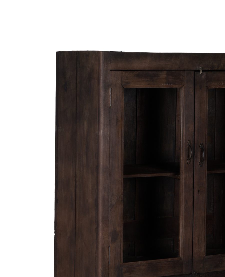 Stained oak vintage Indian wood cabinet, showing side profile and glass door detail.