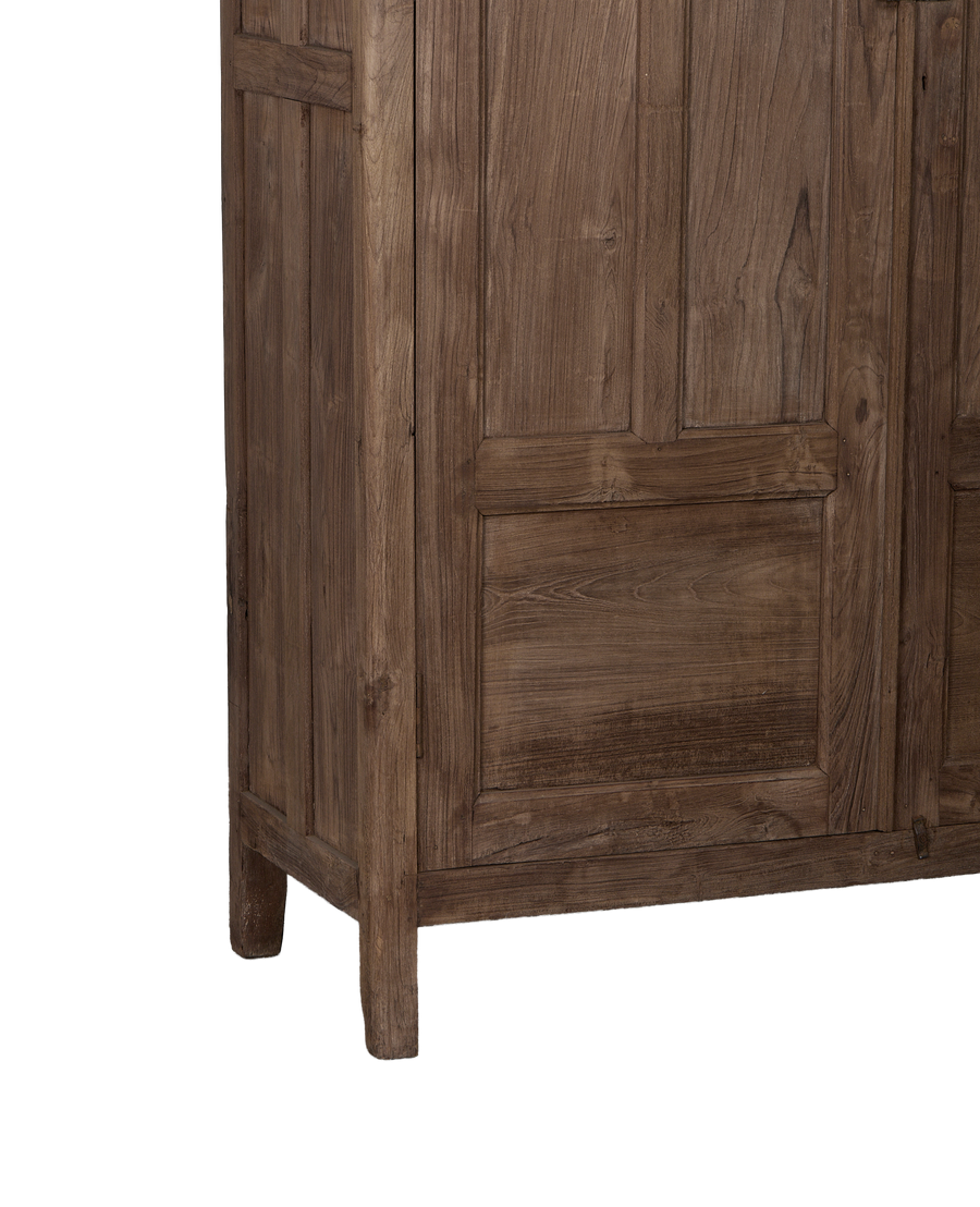 Vintage Indian oak cabinet, showing intricate paneling, natural wood grain, and sturdy leg details.