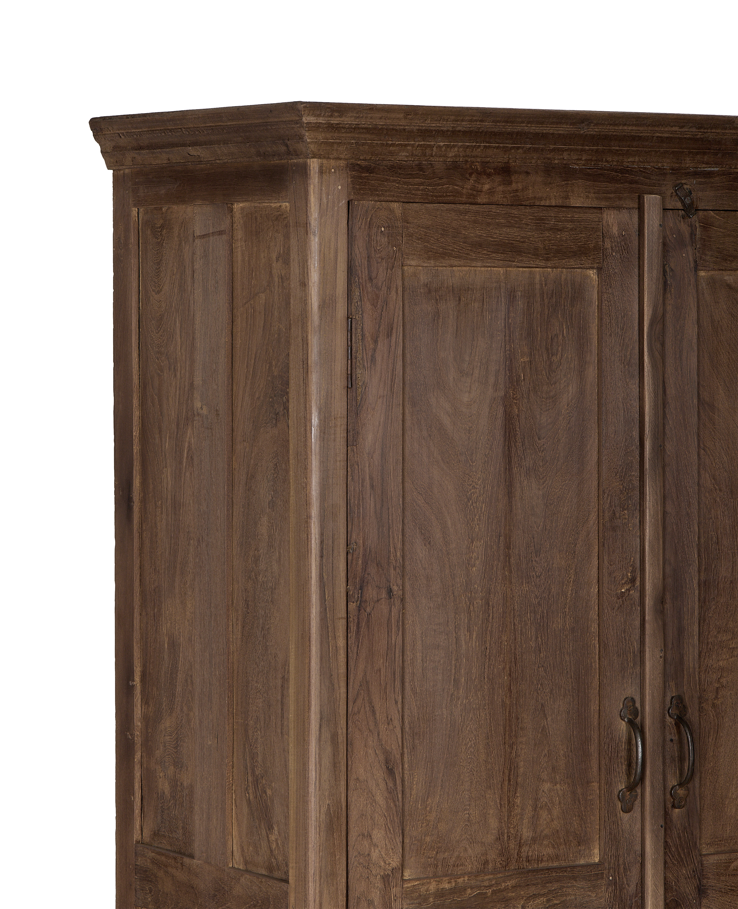 Close-up of vintage Indian oak wood cabinet's door panel and metal handles.