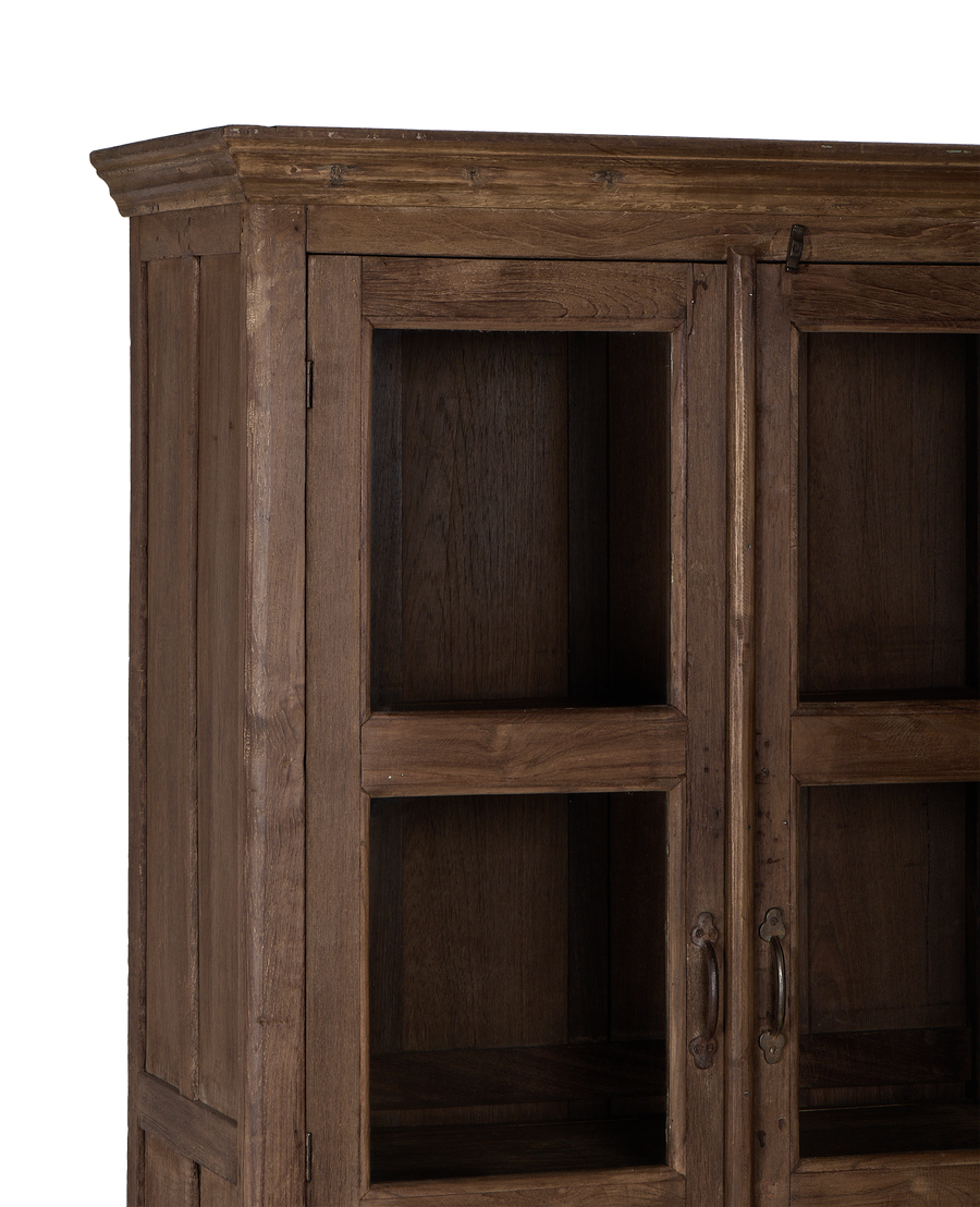 Vintage Indian oak cabinet: detailed close-up of natural wood grain and glass doors.