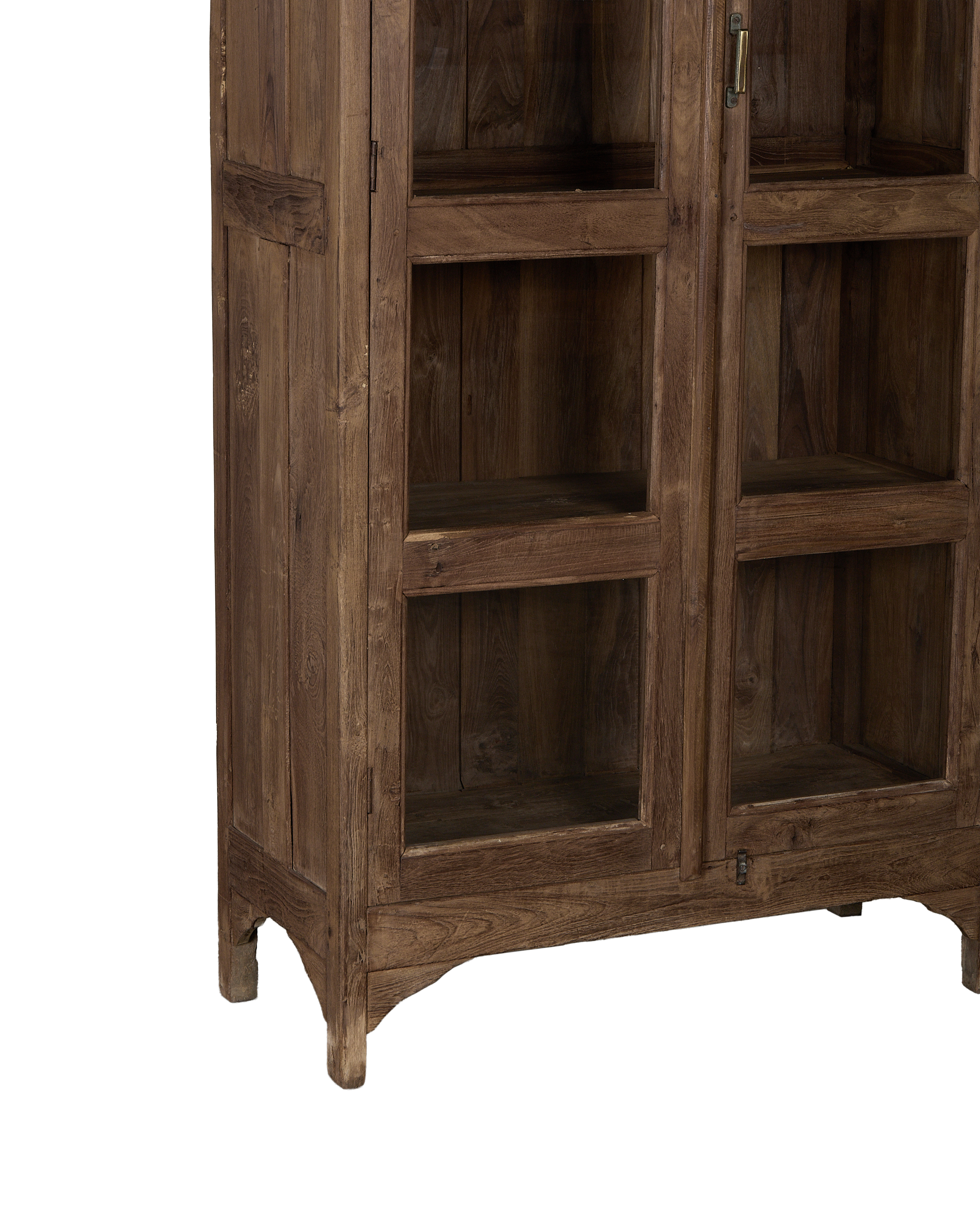 Vintage Indian oak cabinet featuring natural wood grain, glass panels, brass hardware, and arched legs.