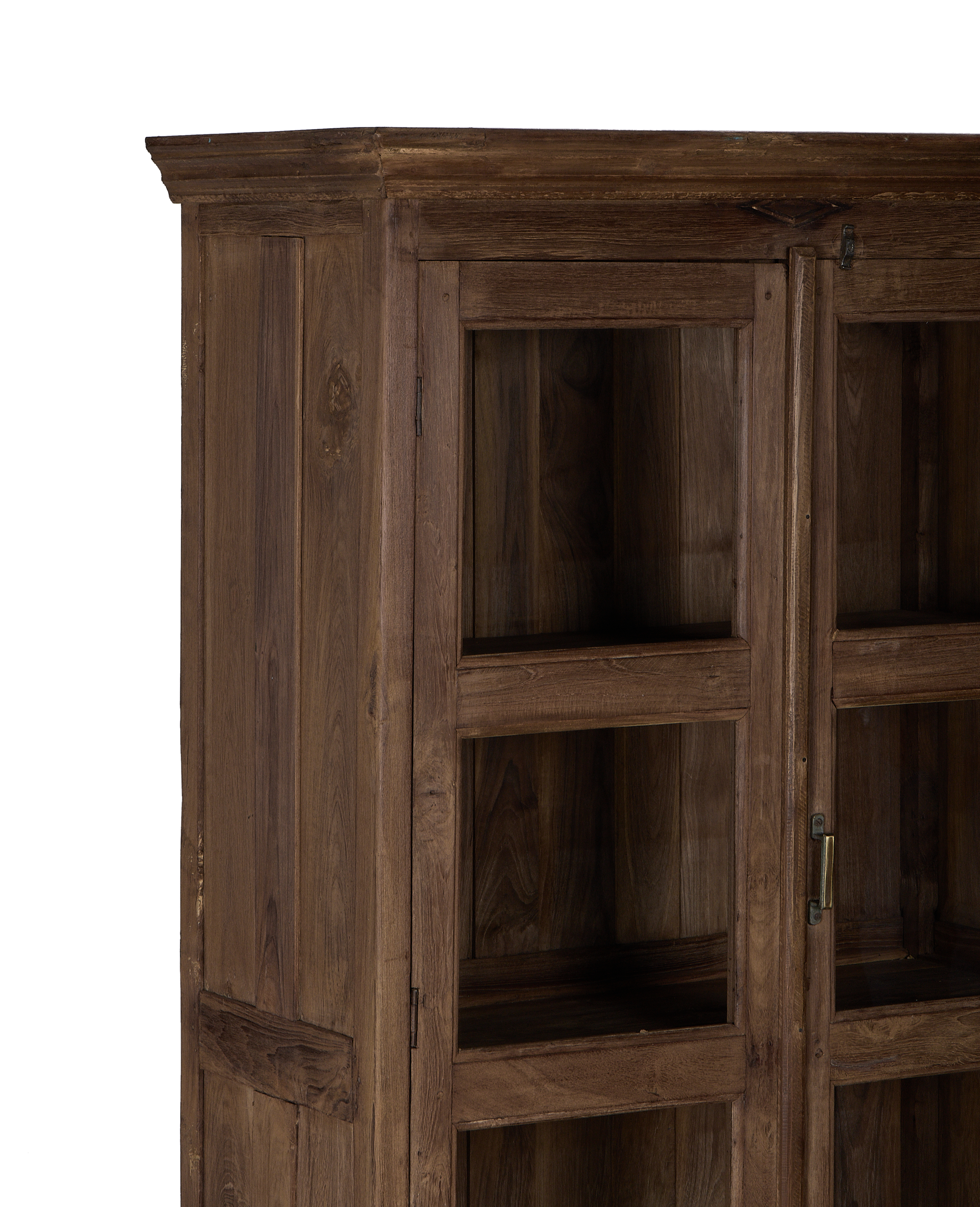 Close-up of vintage Indian oak wood cabinet's natural grain and glass door detail.