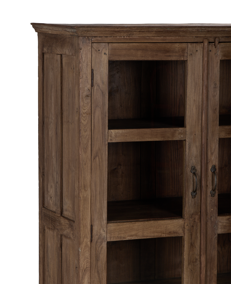 Close-up of vintage Indian oak wood cabinet's natural grain and distressed finish.
