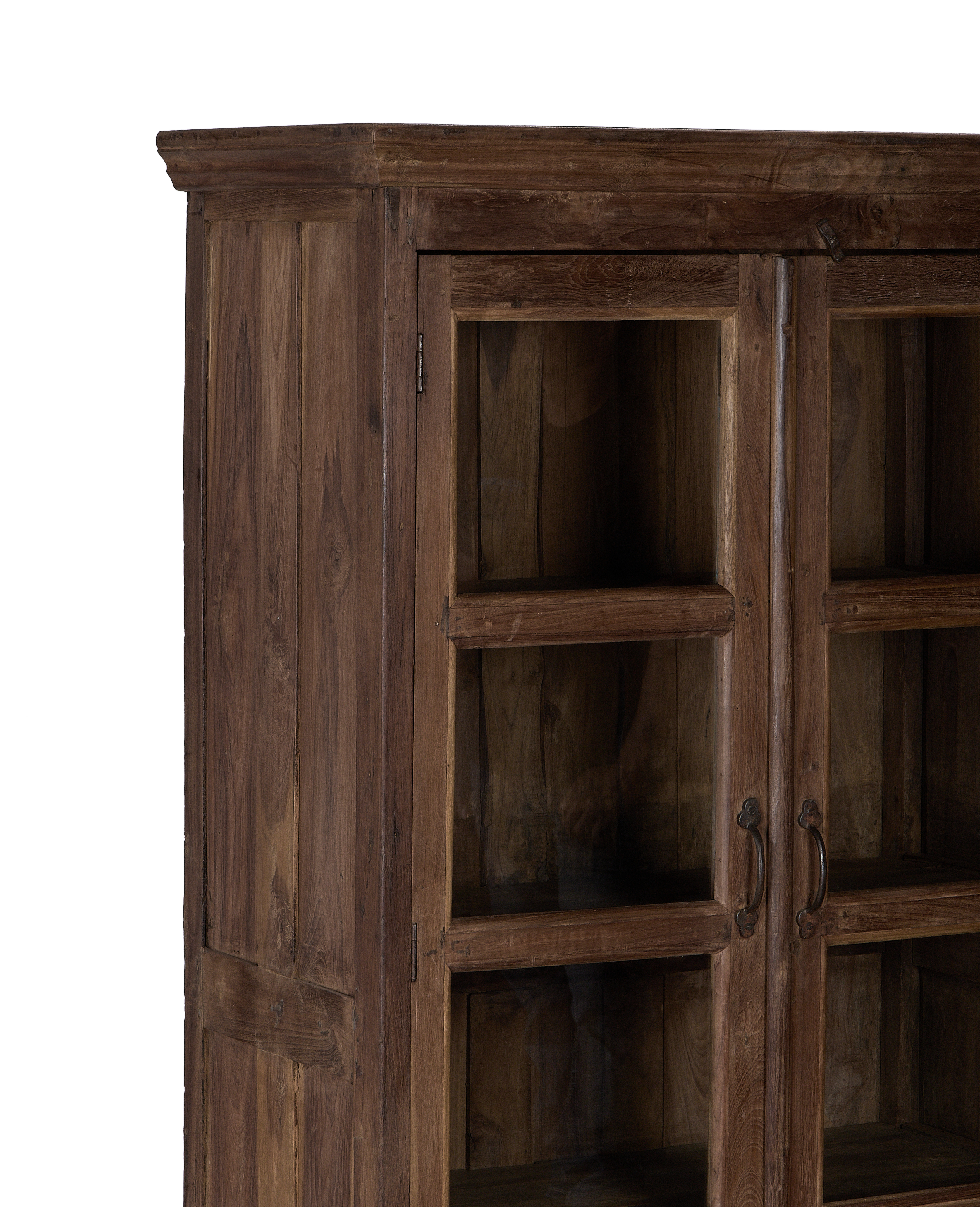 Vintage Indian oak wood cabinet, close-up of glass doors with distressed finish.