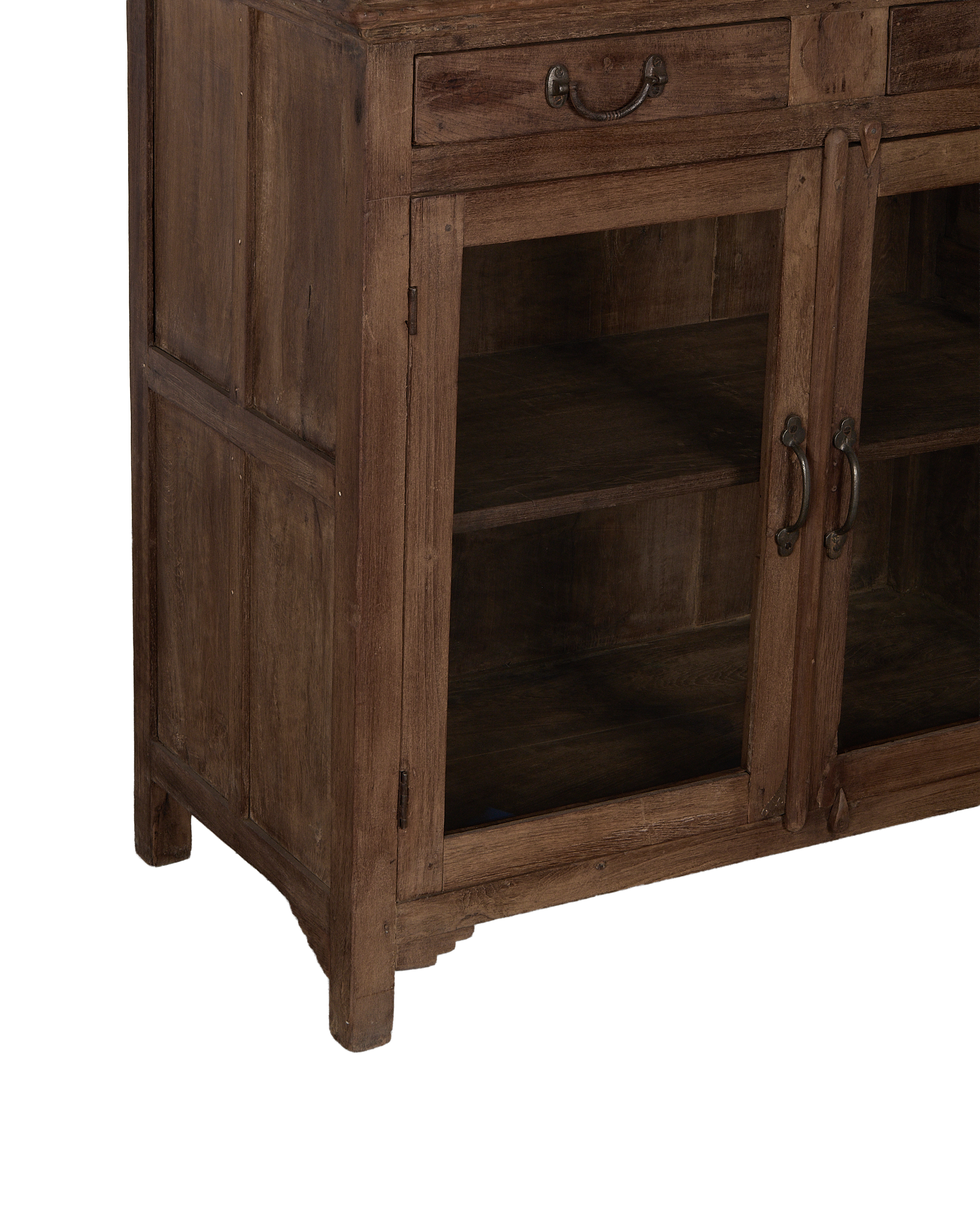 Vintage Indian oak cabinet, showing drawer handle and glass doors with antique pulls.