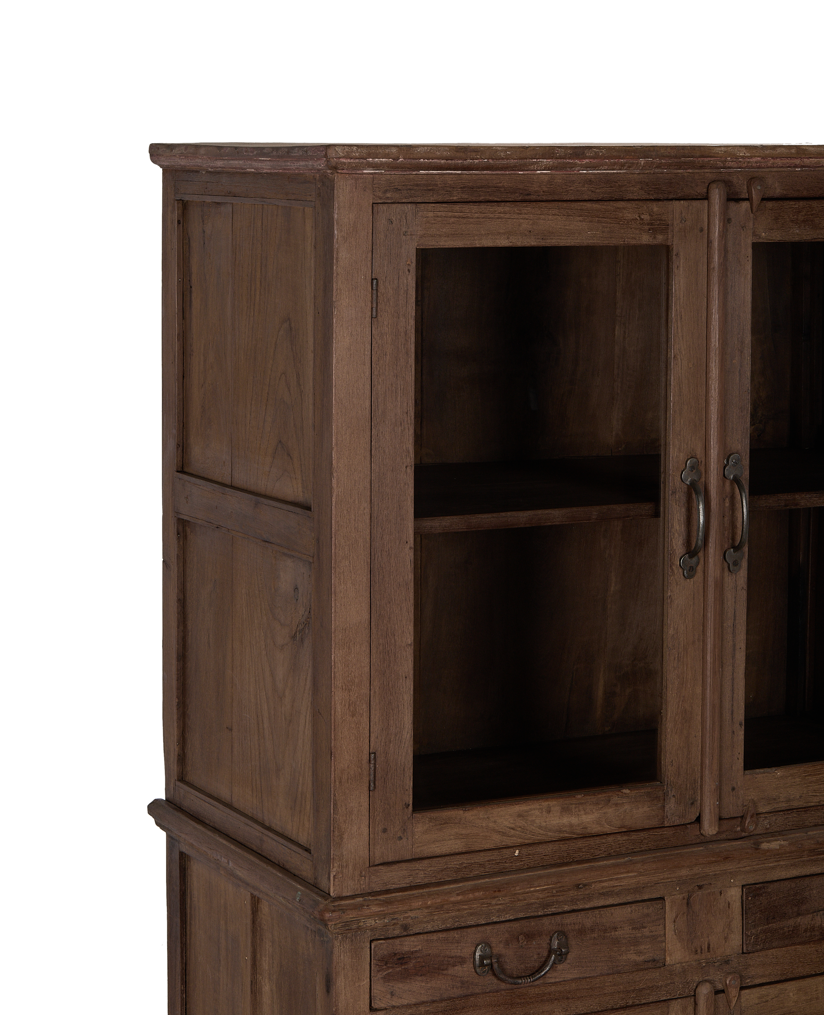 Vintage Indian oak wood cabinet, close-up of glass doors, rustic metal handles.
