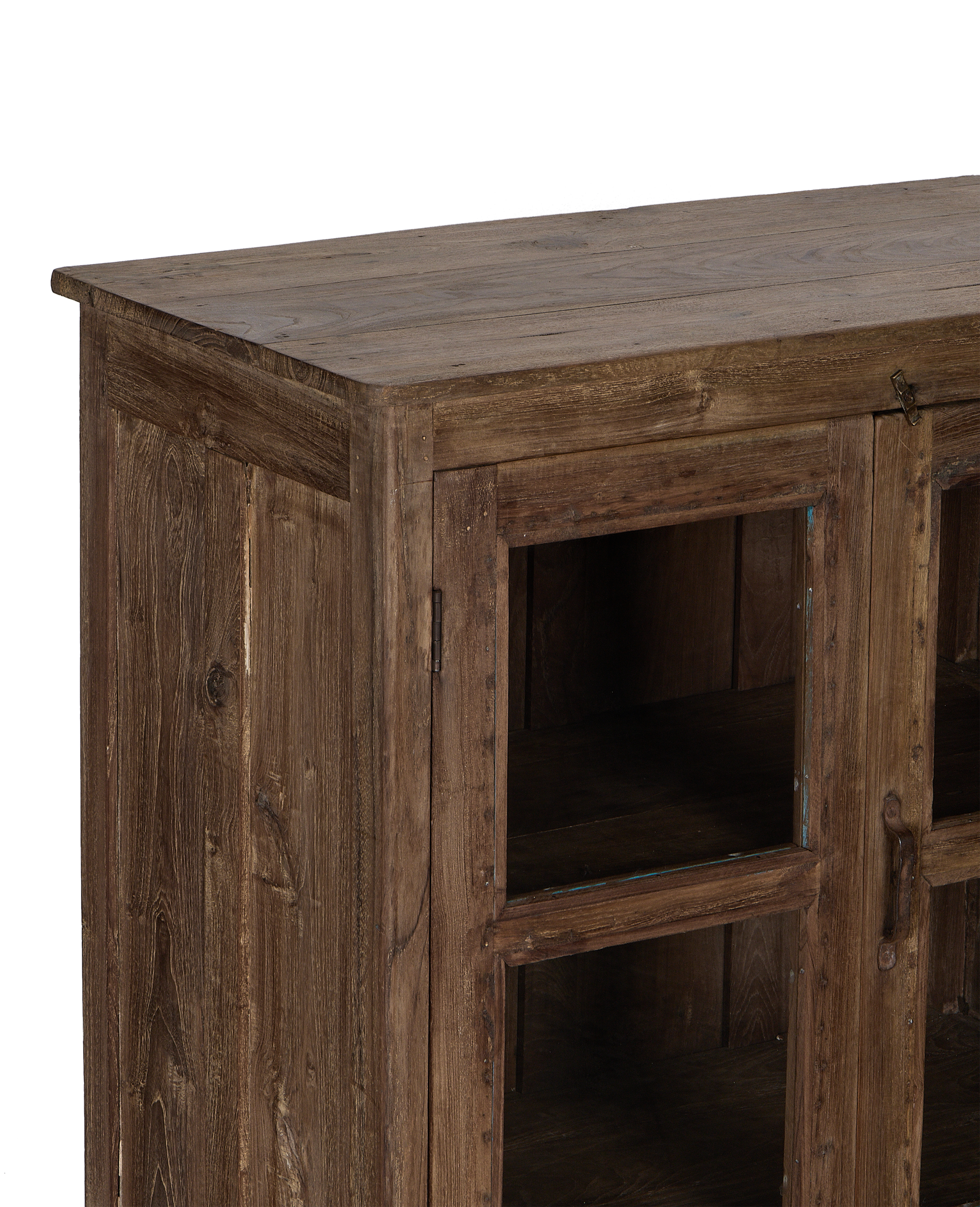 Side view of vintage Indian natural oak wood cabinet showing glass door and rustic texture.