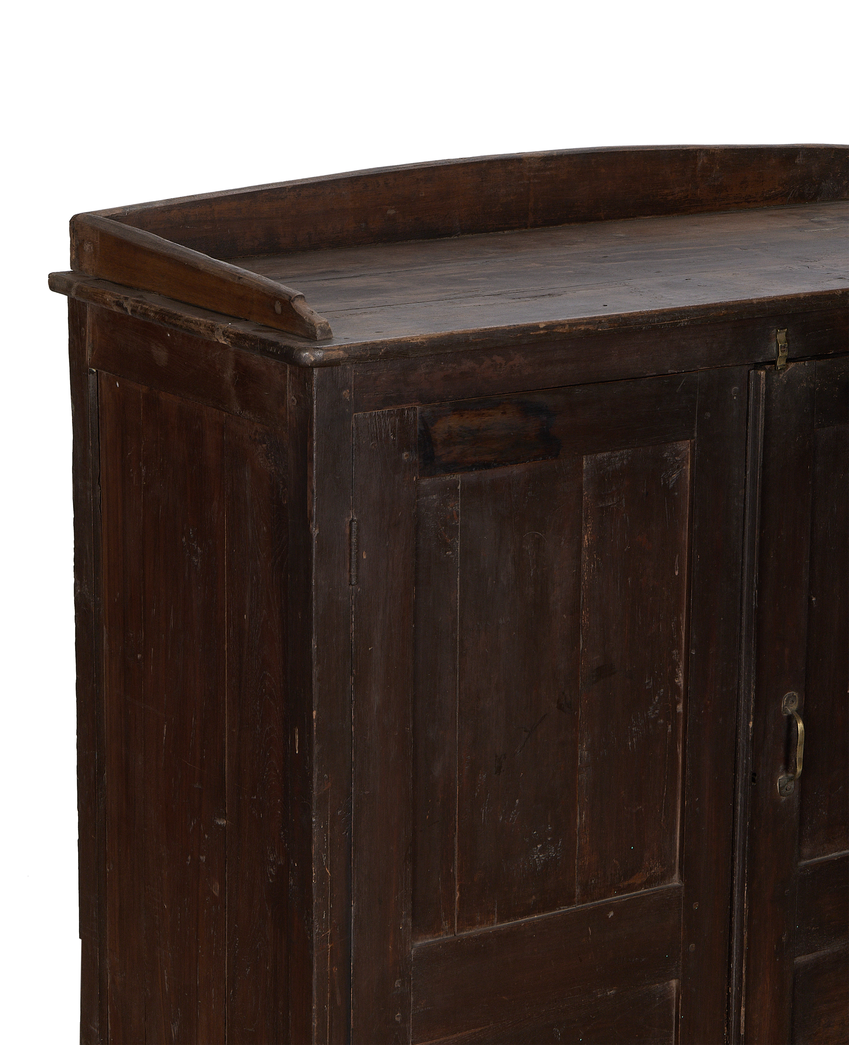 Close-up side view of vintage Indian natural oak cabinet, showing worn wood grain.