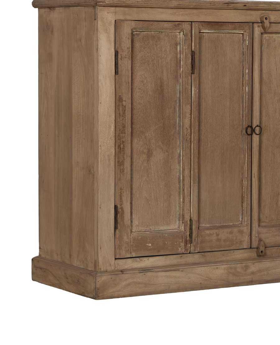 Side view of vintage bleached oak cabinet from India, showing rustic doors and base.