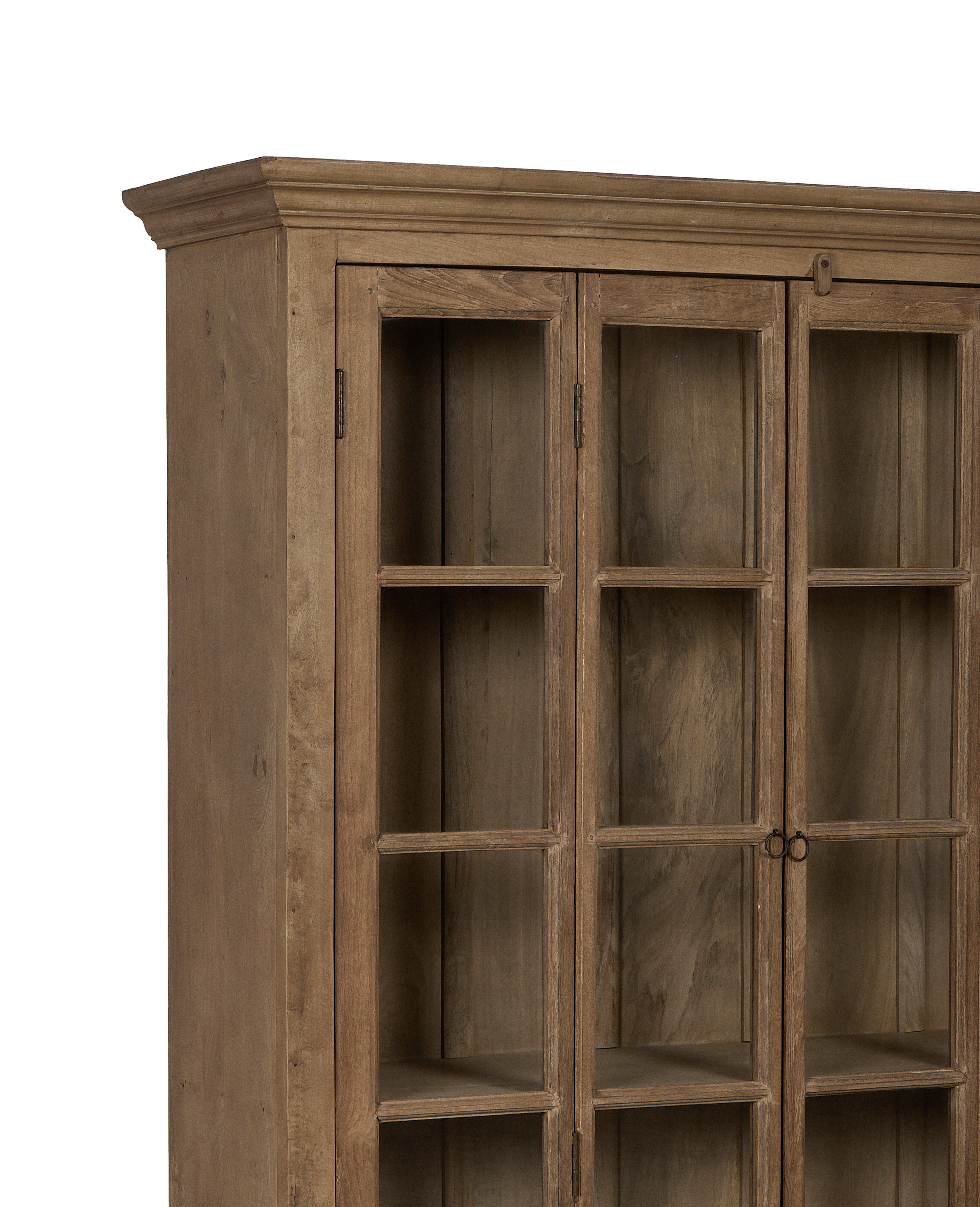 Vintage bleached oak cabinet with glass doors showcasing interior shelving and aged hinges.