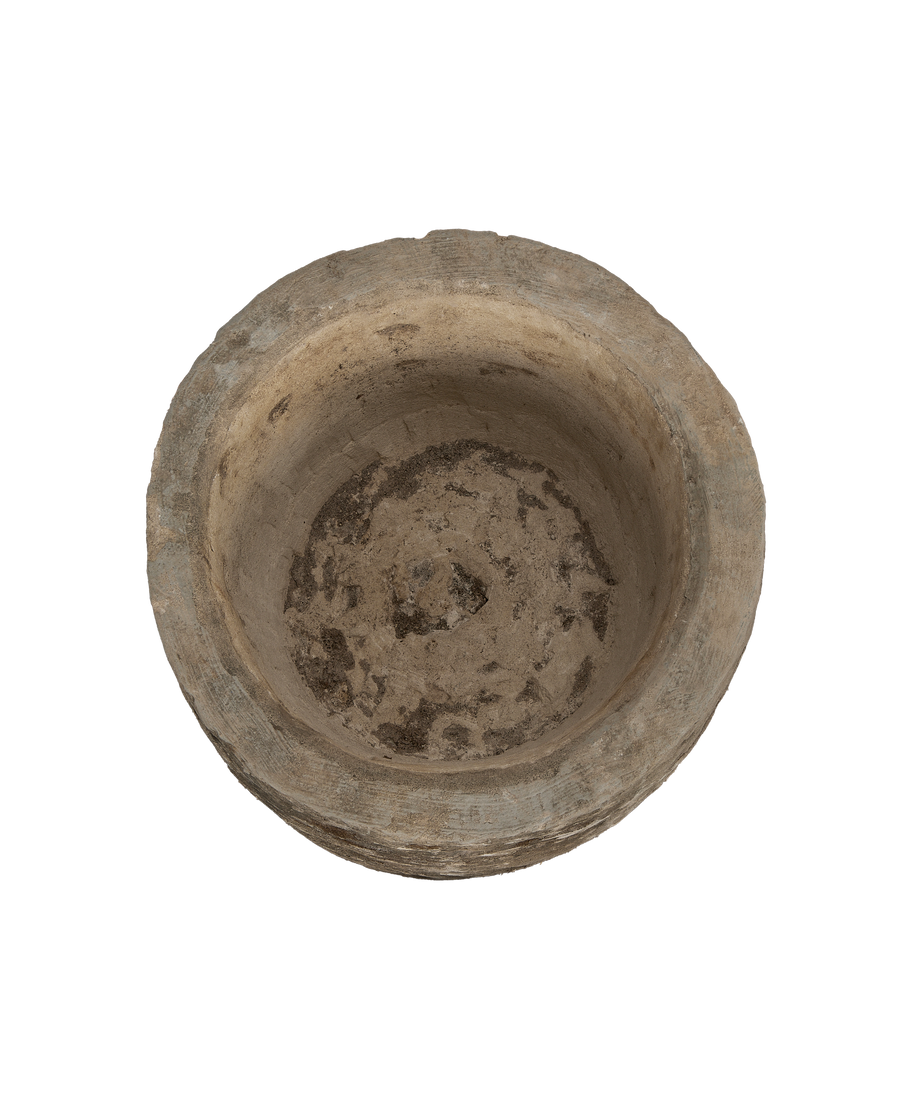 Vintage Indonesian limestone trough, top-down view showing weathered, textured interior.