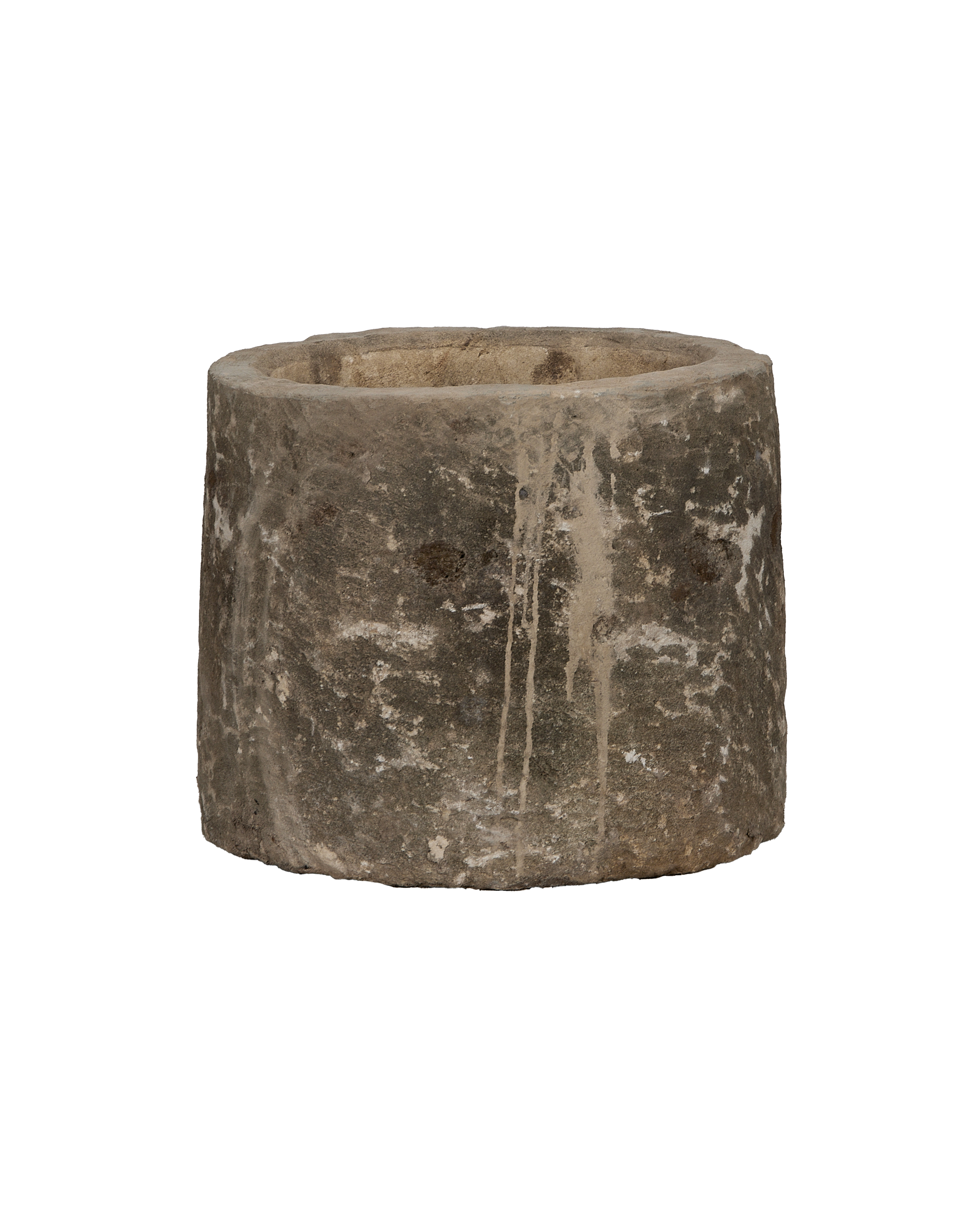 Vintage round limestone trough from Indonesia, showing rough exterior texture with aged drips.