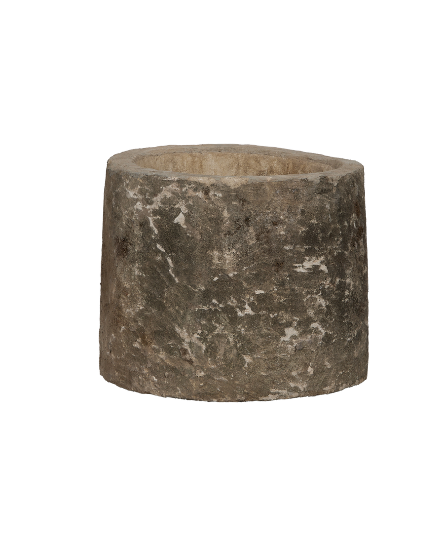Vintage Indonesian round limestone trough, showing weathered side texture and interior lip.