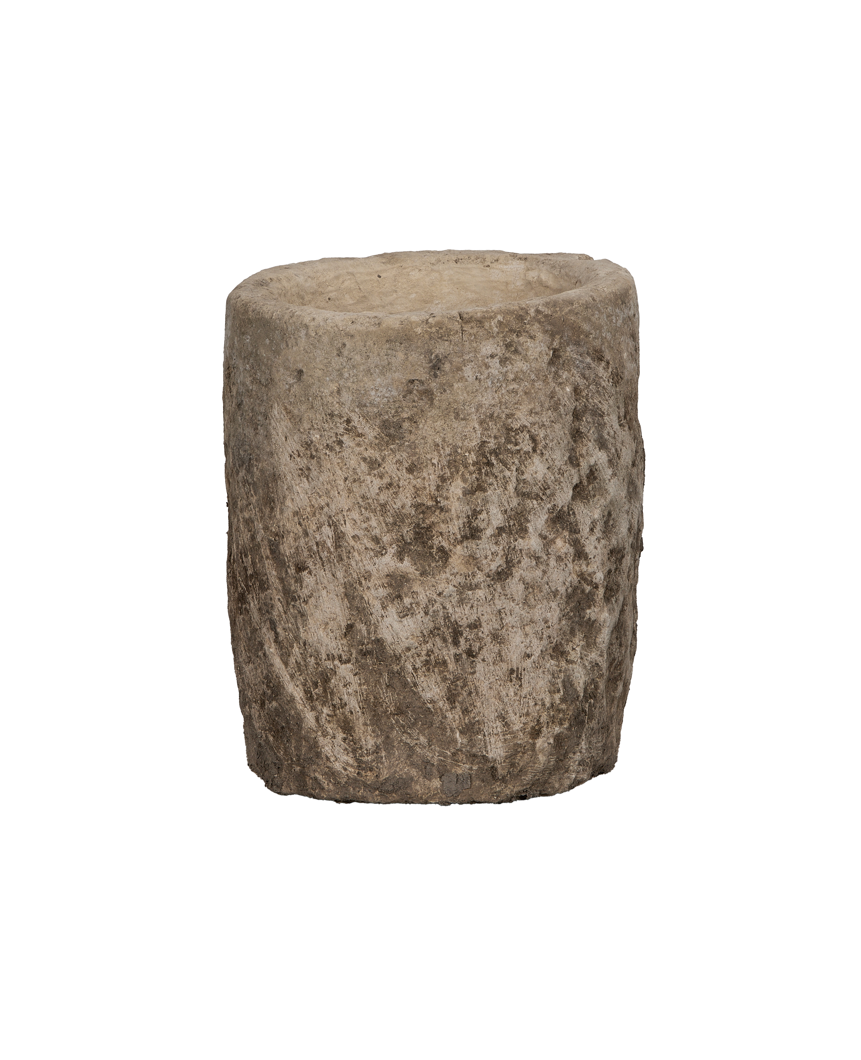 Vintage round limestone trough from Indonesia with rugged textured surface on black background.