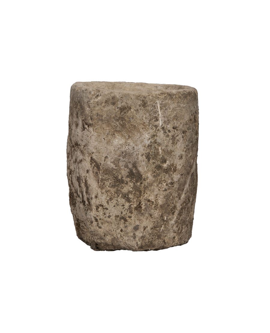 Vintage round limestone trough, rich Indonesian origins, showcasing its textured, weathered exterior condition.