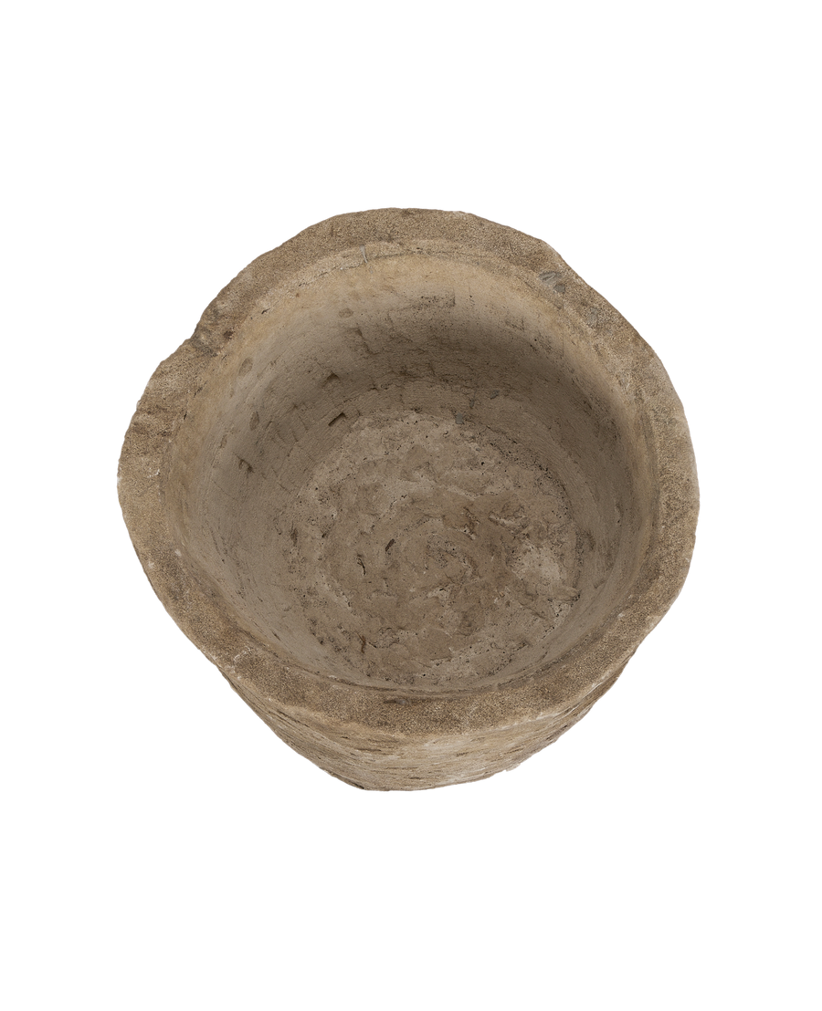 Vintage round Indonesian limestone trough, top-down view showing interior texture.