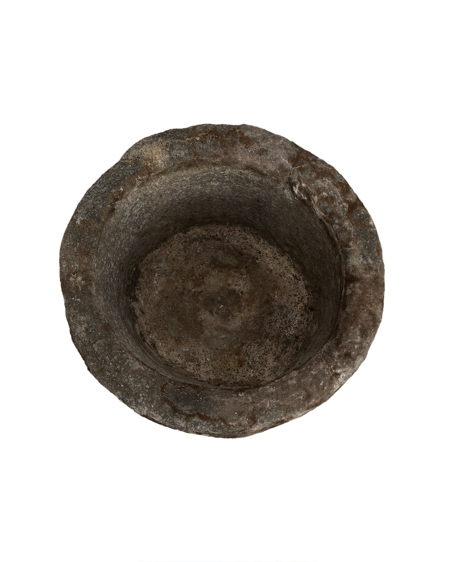 Vintage Indonesian limestone trough, top-down view showing deep round basin and weathered texture.