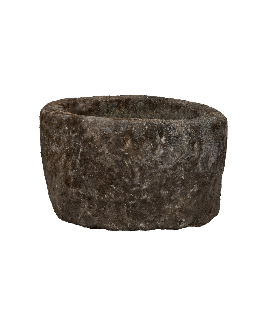 Vintage round limestone trough, rich textured surface, weathered grey patina, front-facing view.