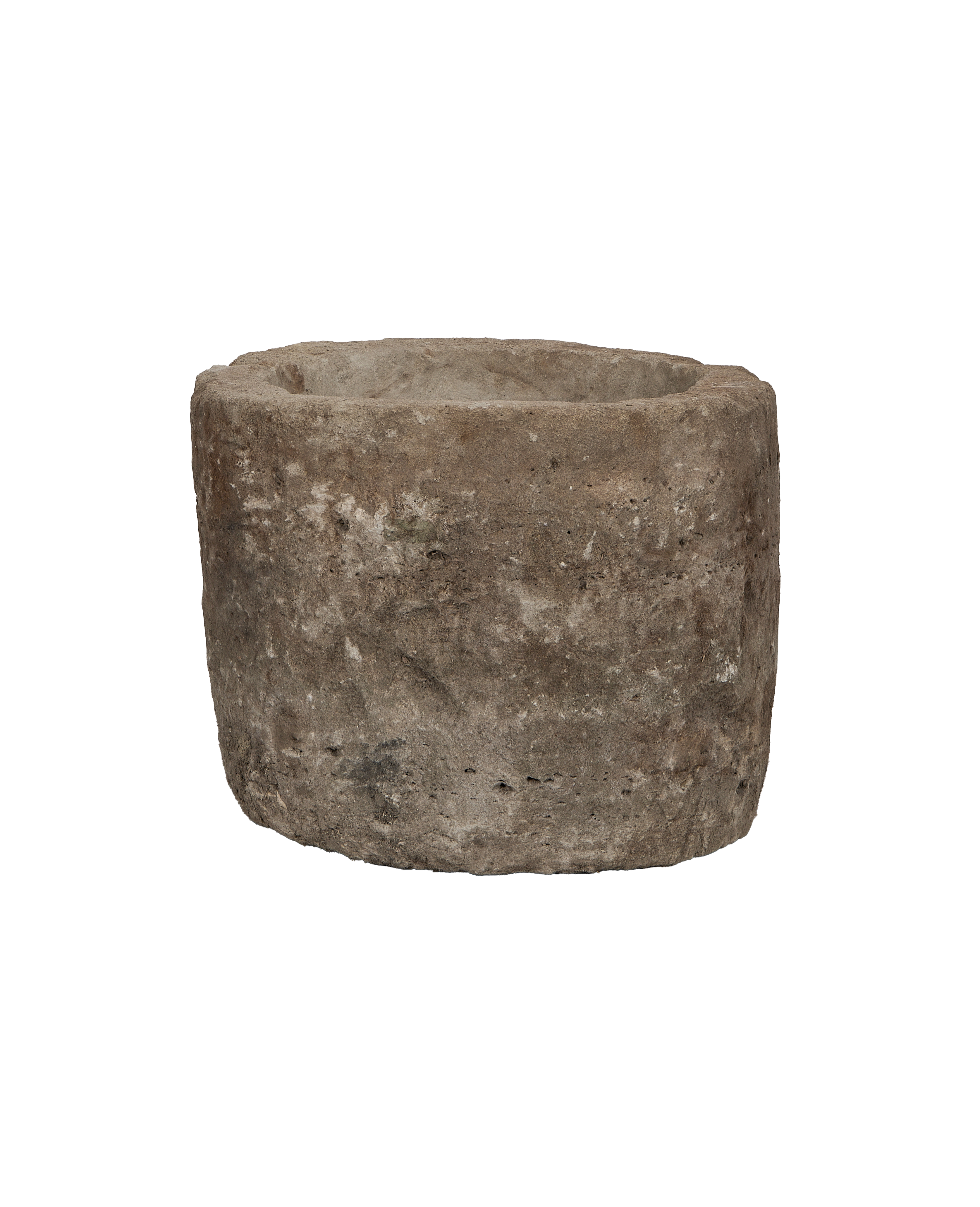 Vintage Indonesian round limestone trough, showing weathered texture from an elevated angle.