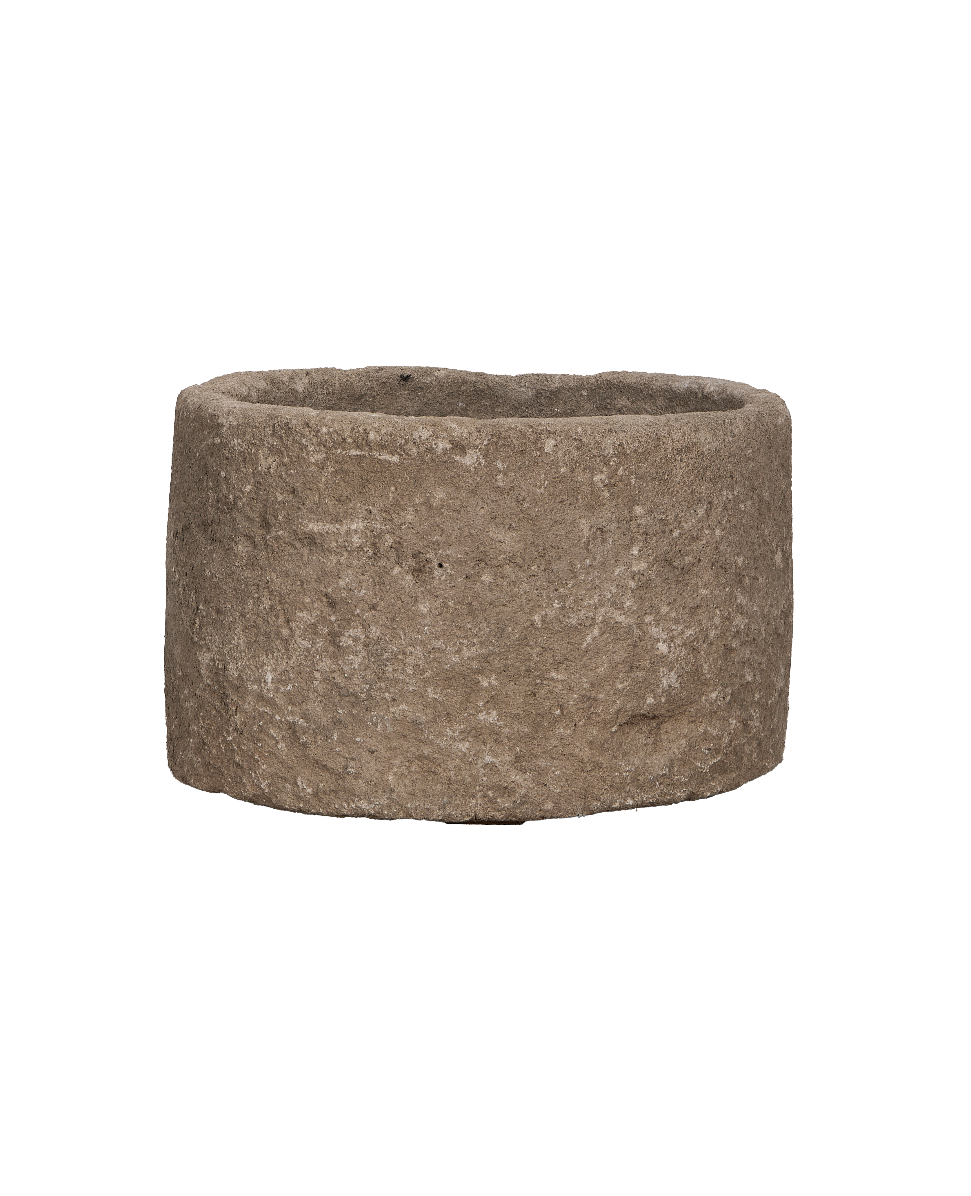 Vintage Indonesian round limestone trough, showing varied textures and rugged side profile.
