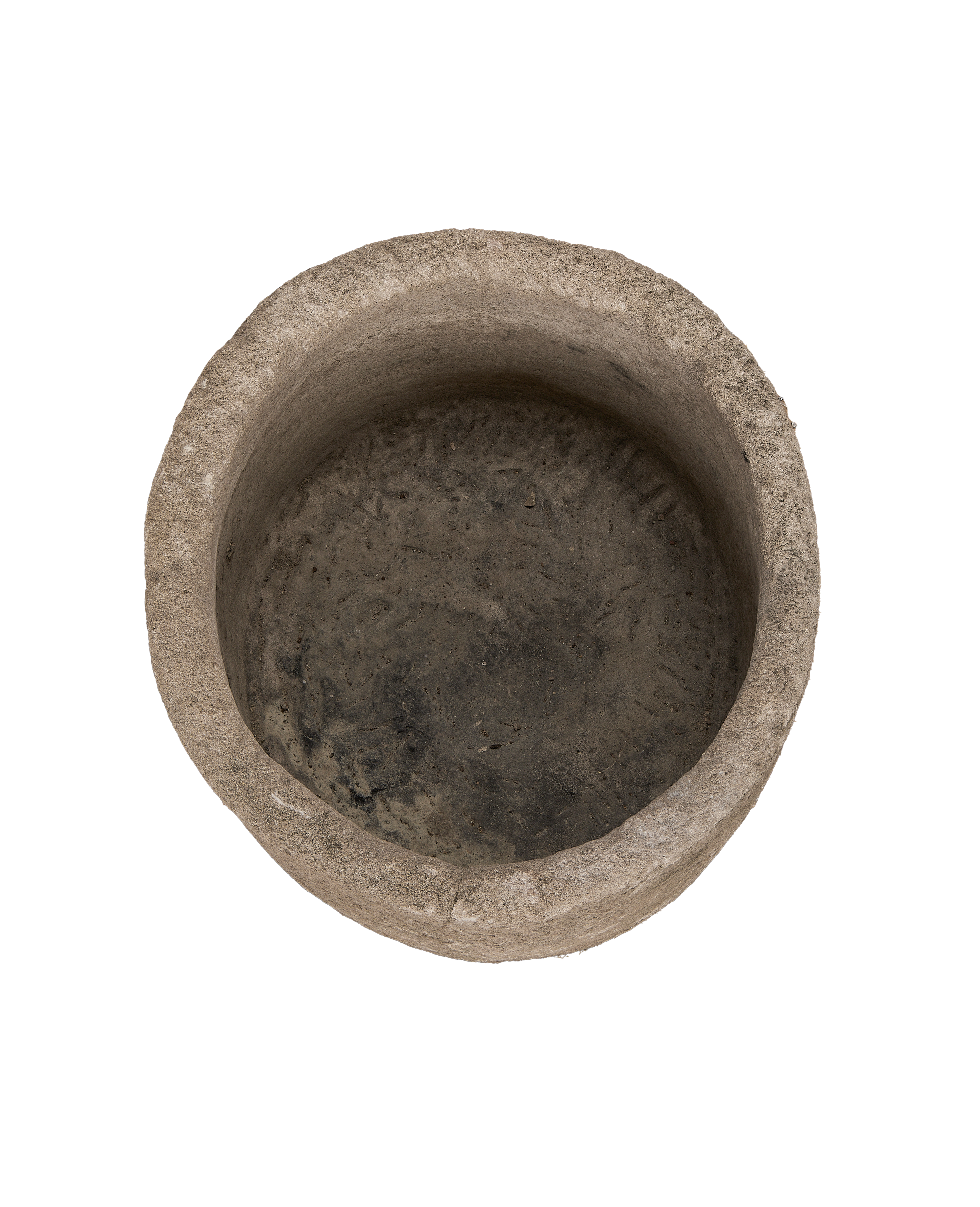 Vintage Indonesian round limestone trough, top-down view showing interior texture and aged patina.