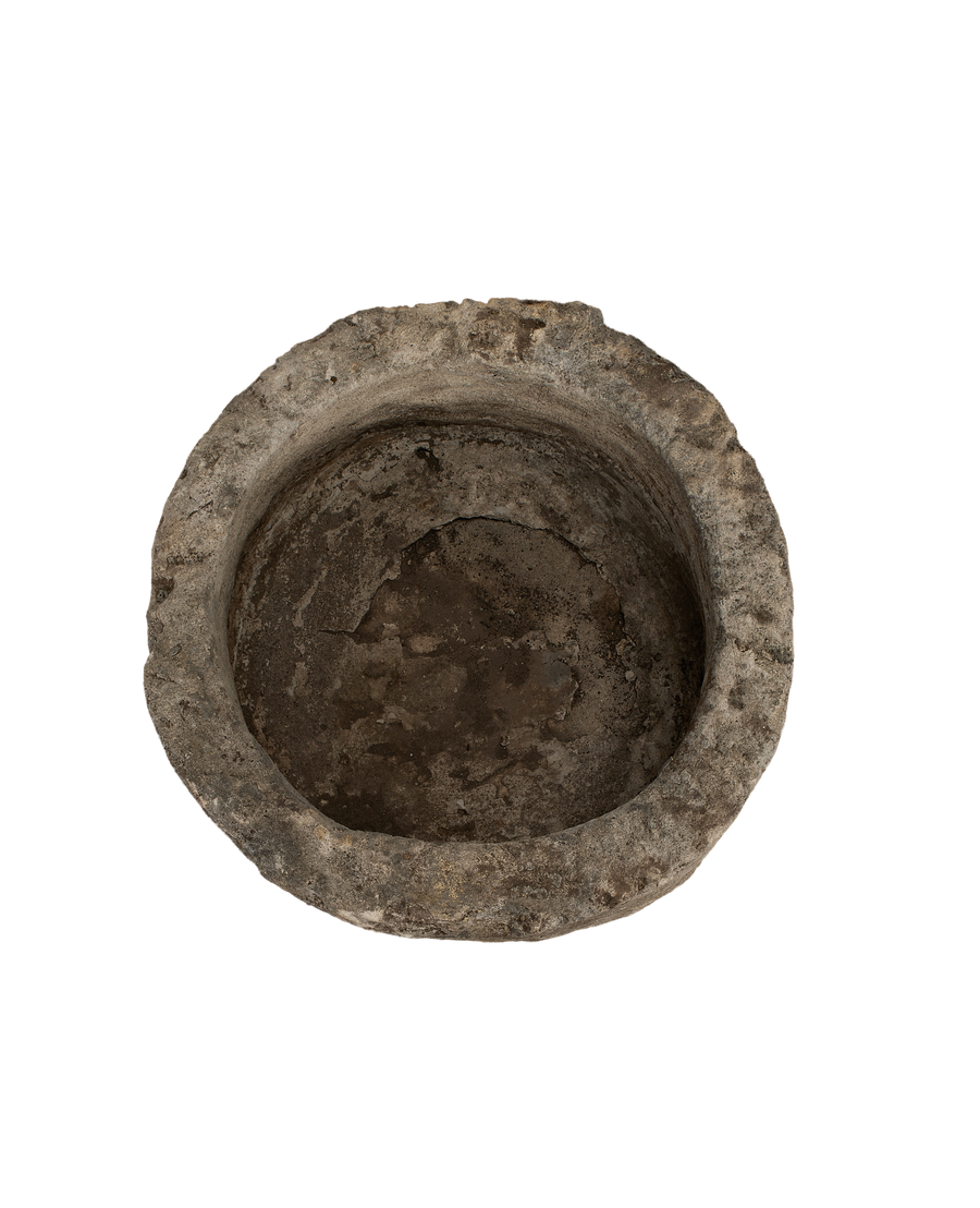 Vintage Indonesian round limestone trough, top-down view showing interior texture and aged patina.
