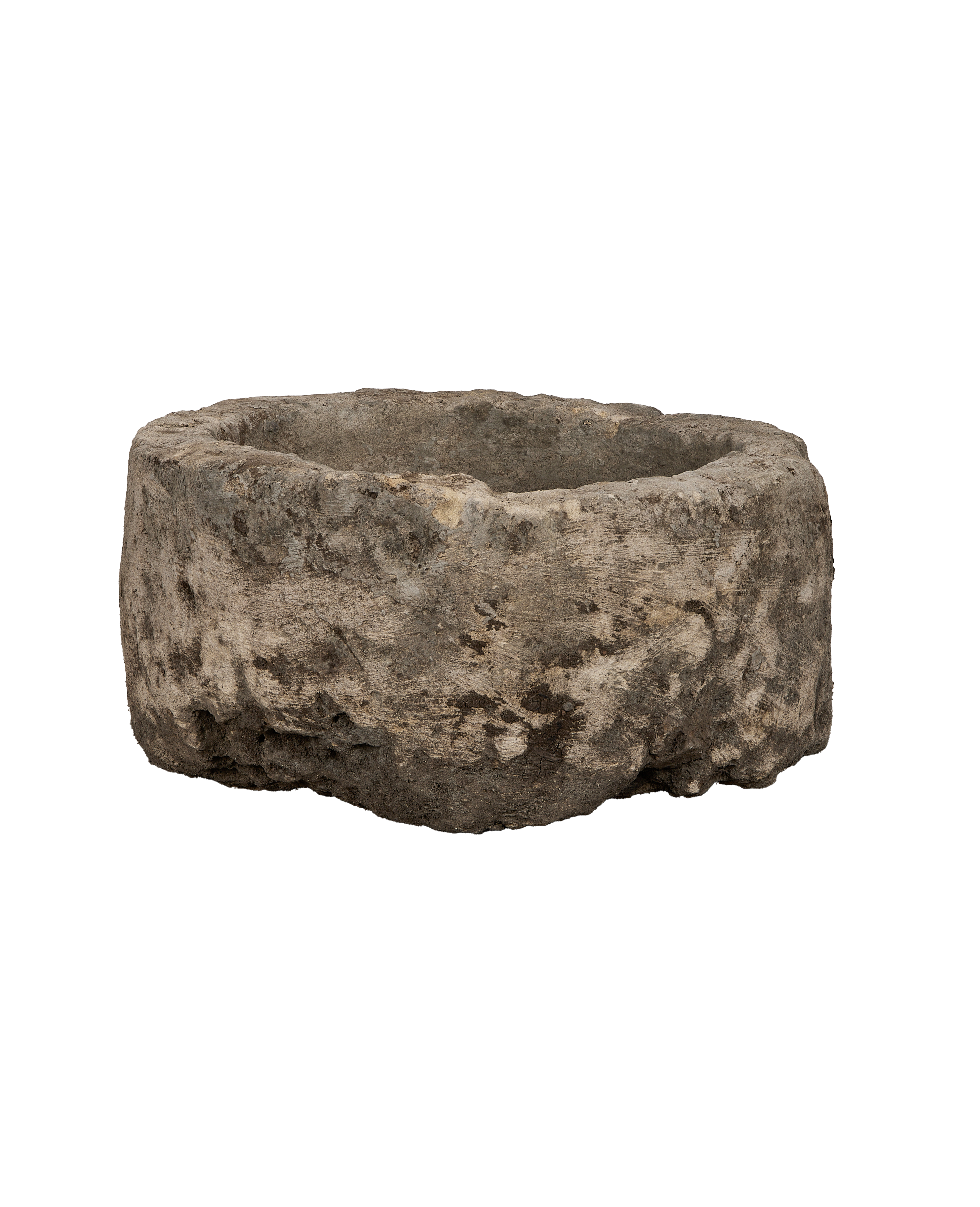 Vintage round Indonesian limestone trough, showing a side view of its rustic, weathered texture.