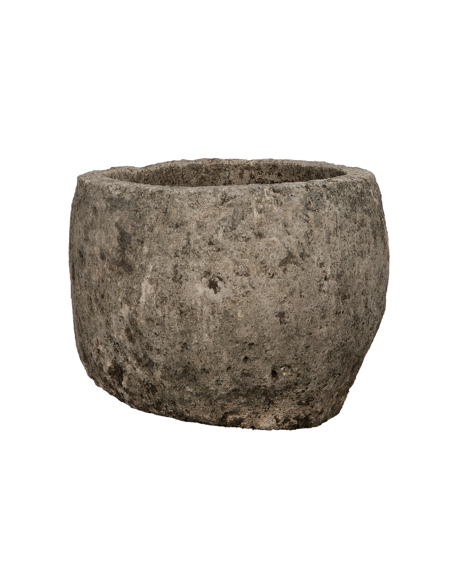 Vintage Indonesian round limestone trough, showing its aged, weathered texture and imperfections.